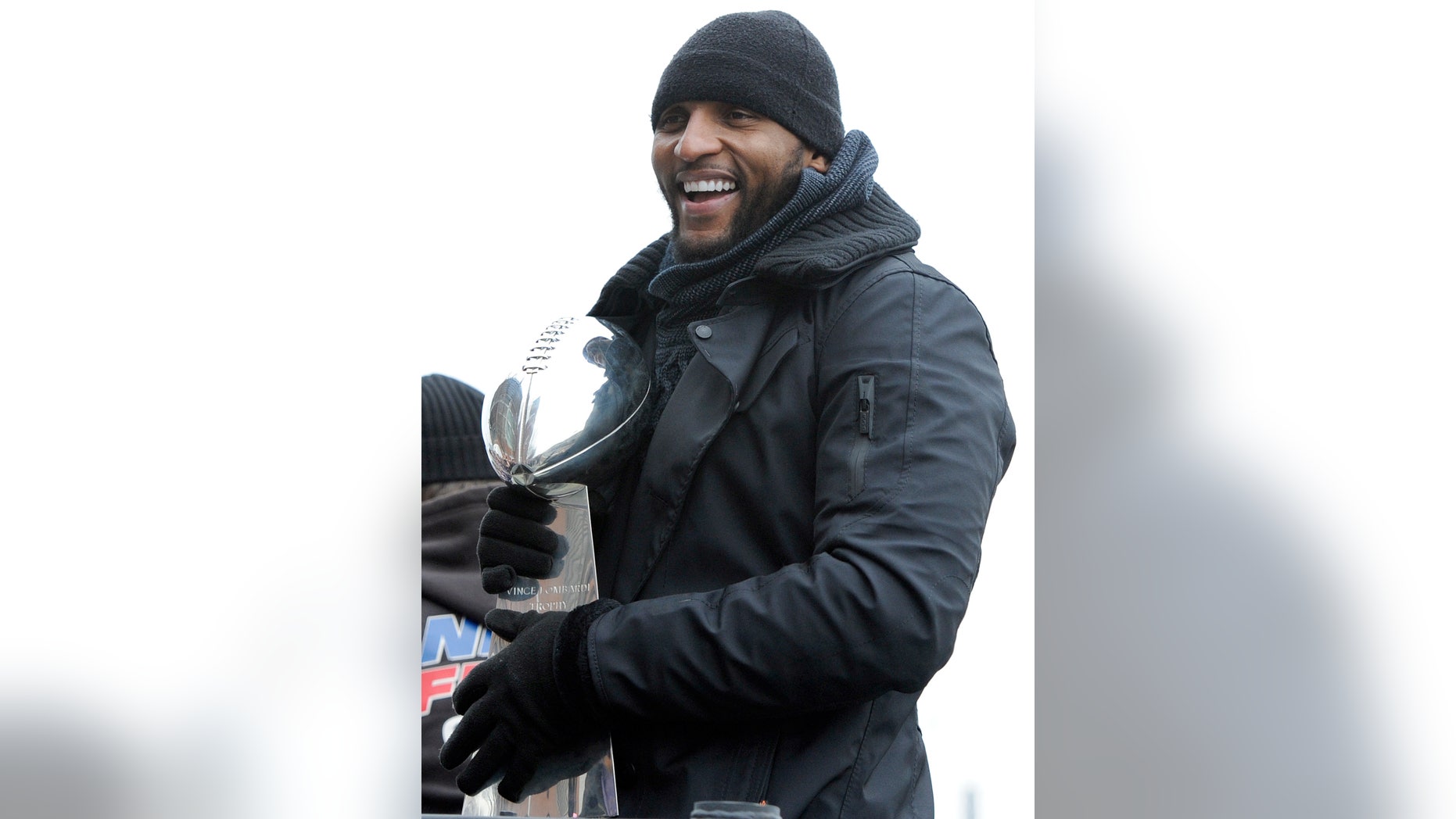 Baltimore Ravens linebacker Ray Lewis holds the Vince Lombardi trophy during a parade and celebration of the team's Super Bowl championship in Baltimore Tuesday, Feb. 5, 2013. The Ravens defeated the San Francisco 49ers 34-31 in Super Bowl XLVII on Sunday. (AP Photo/Steve Ruark)