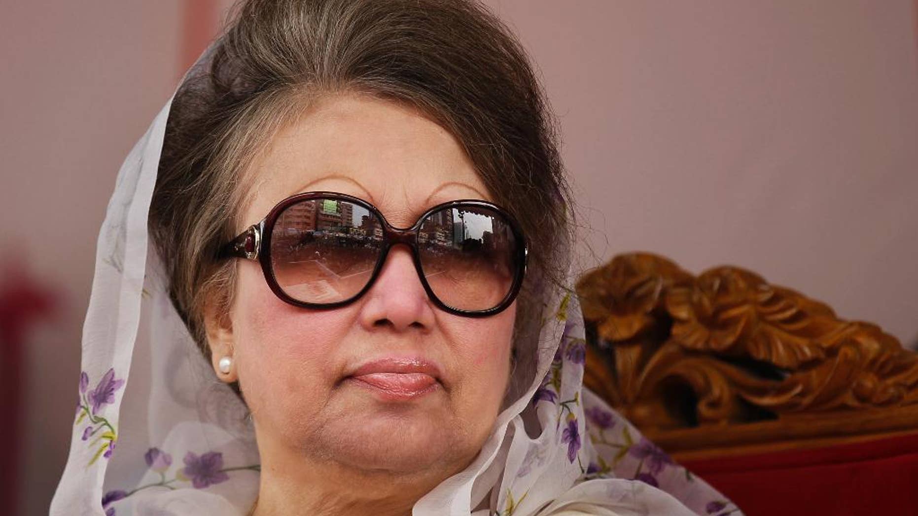 FILE-In this Jan. 5, 2016 file photo, Bangladesh's former prime minister and Bangladesh Nationalist Party (BNP) leader Khaleda Zia, looks on at a protest rally to mark the second anniversary of a general election boycotted by a major opposition alliance in Dhaka, Bangladesh. Police in Bangladesh questioned a prominent journalist and close aide of opposition leader and ex-Prime Minister Khaleda Zia over the weekend for his alleged role in a conspiracy to kidnap the only son of the current prime minister. (AP Photo/ A.M. Ahad, File)