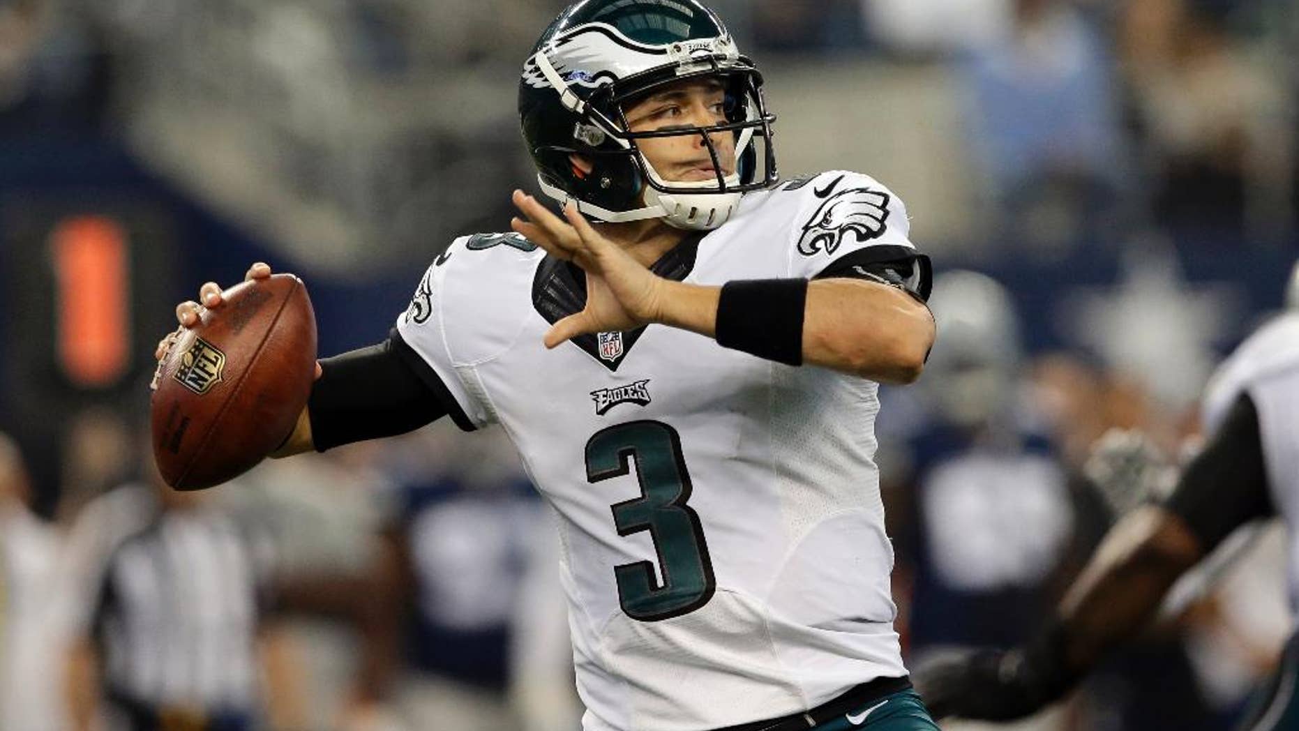 Philadelphia Eagles quarterback Mark Sanchez (3) prepares to pass against the Dallas Cowboys during the first half of an NFL football game, Thursday, Nov. 27, 2014, in Arlington, Texas. (AP Photo/Tim Sharp)