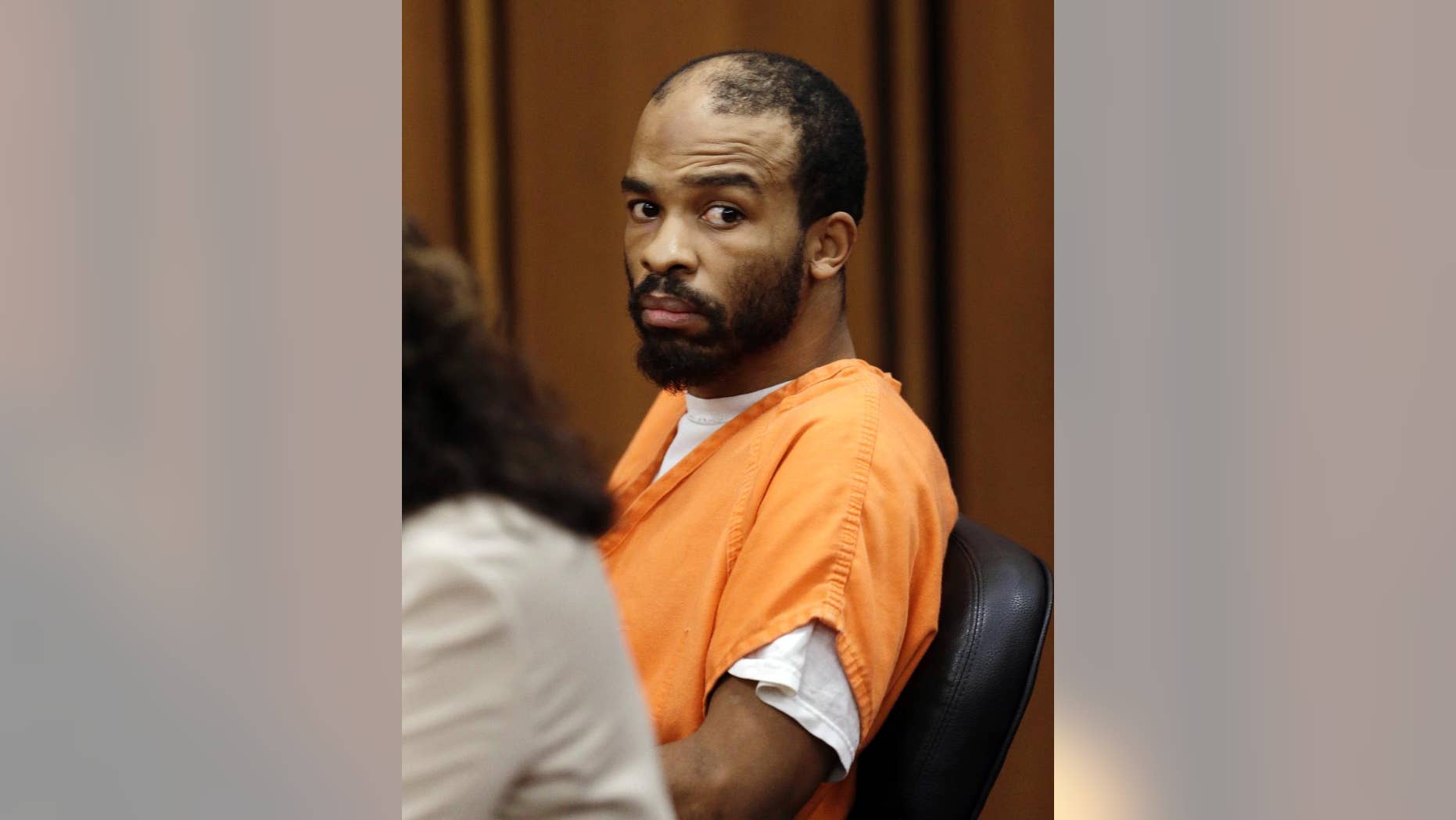 FILE - In this Aug. 20, 2013, file photo, Michael Madison looks toward the prosecuting attorney during a pretrial hearing, in Cleveland. A jury is set to begin hearing arguments on whether Madison, convicted of murdering three women in the Cleveland area whose bodies were found wrapped in garbage bags, should receive the death penalty. Attorneys for Madison will make arguments Thursday, May 12, 2016, in a Cleveland courtroom for sparing his life. (AP Photo/Tony Dejak, File)