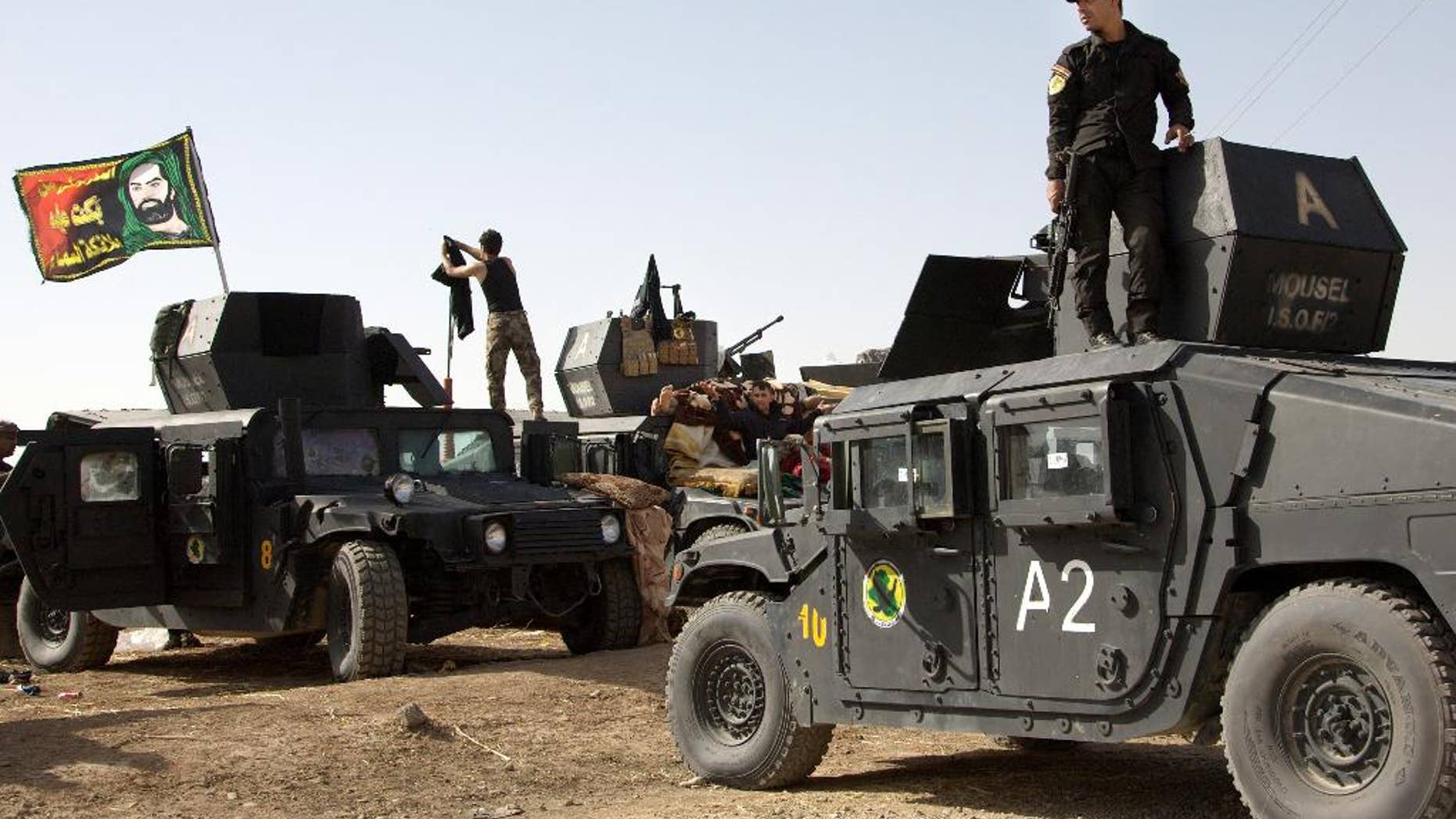 Oct. 14, 2016: Iraqi special forces soldiers deployed for an offensive to retake Mosul from Islamic State militants prepare to move out from a camp near Khazer, Iraq.