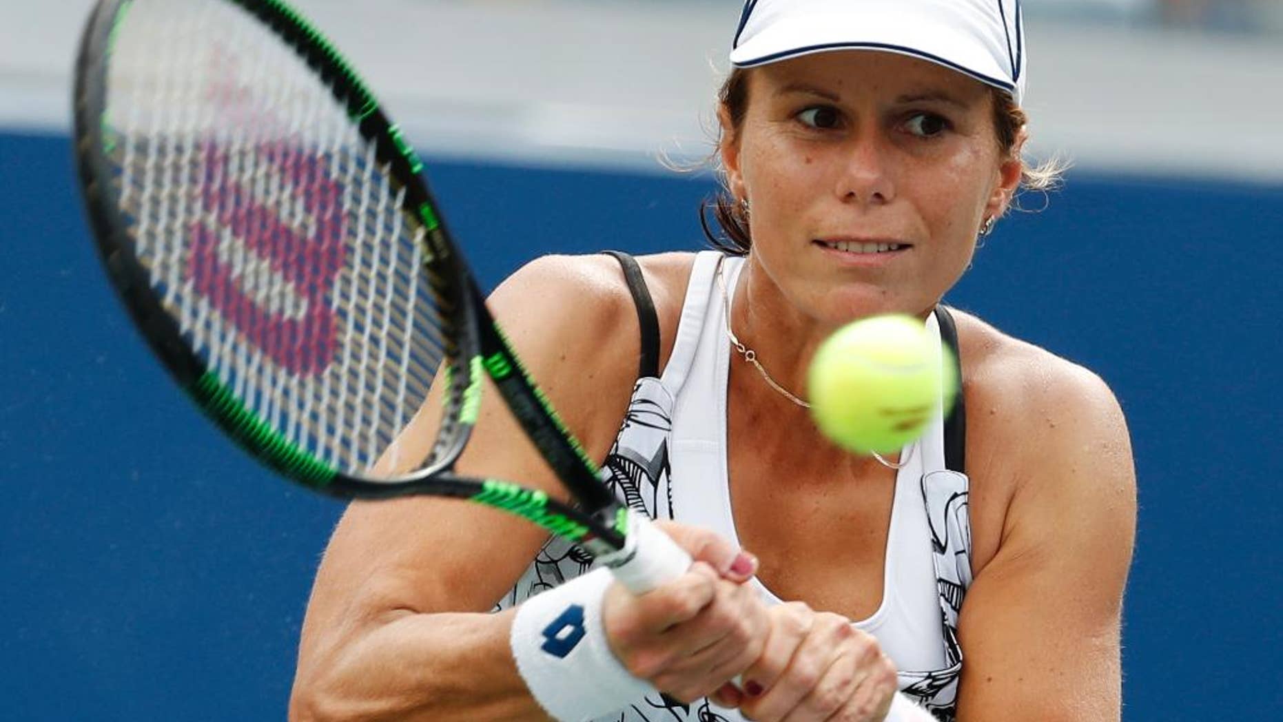 FILE - In this Sept. 3, 2016, file photo, Varvara Lepchenko, of the United States, returns a shot to Ana Konjuh, of Croatia, during the third round of the U.S. Open tennis tournament in New York. Lepchenko tested positive four times for meldonium, according to the International Tennis Federation, which cleared her because it was determined she took the substance before its ban went into effect on Jan. 1. The ITF announced Tuesday, Sept. 20, 2016, that Lepchenko had been provisionally suspended in March but it was later determined that she “bore no fault or negligence for the violation.” (AP Photo/Alex Brandon, File)