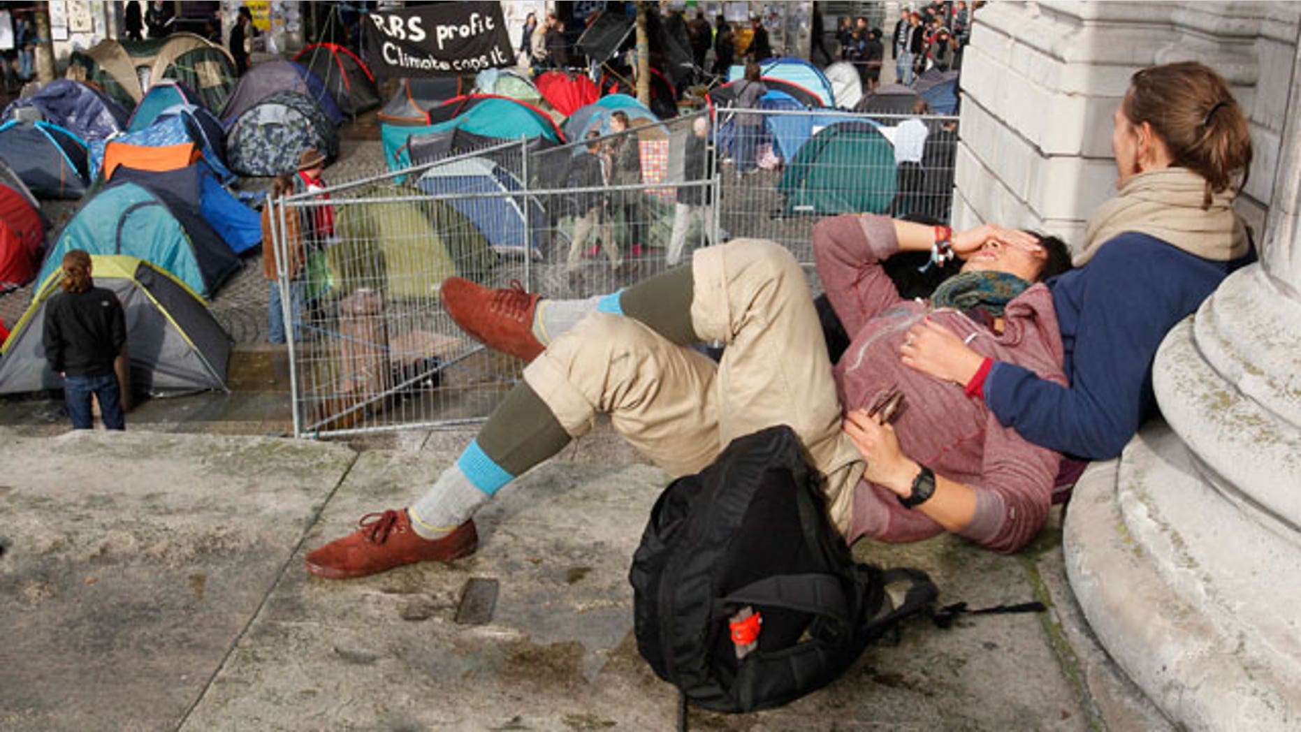 Oct. 27, 2011: People lie on the steps outside St Paul's Cathedral in London.