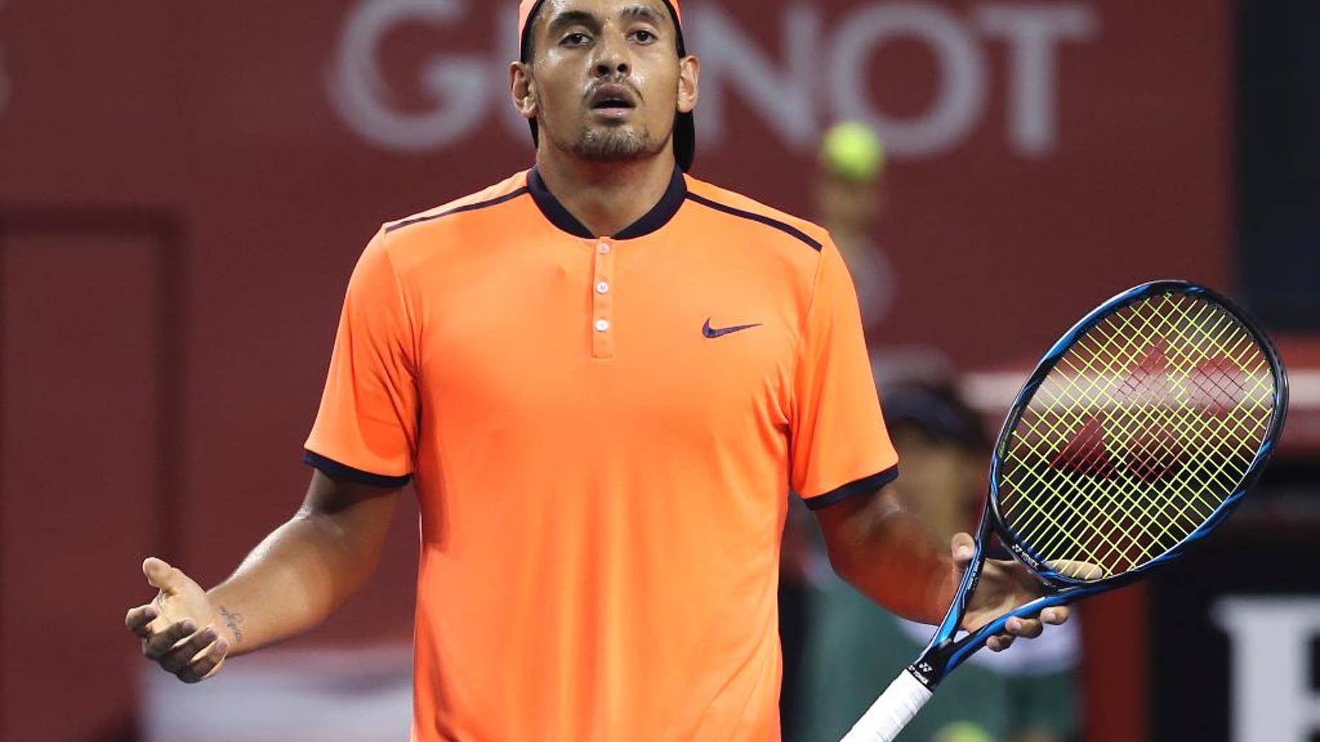 FILE - In this Saturday, Oct. 8, 2016, file photo, Australia's Nick Kyrgios reacts after getting a point against Gael Monfils of France during the semifinal match of Japan Open tennis championships in Tokyo. Kyrgios was booed during a listless 6-3, 6-1 loss to Mischa Zverev at the Shanghai Masters on Wednesday, Oct. 12, 2016, then angrily defended his behavior by saying he didn't owe the spectators anything and fans could "just leave" if they didn't like his attitude. (AP Photo/Koji Sasahara, File)