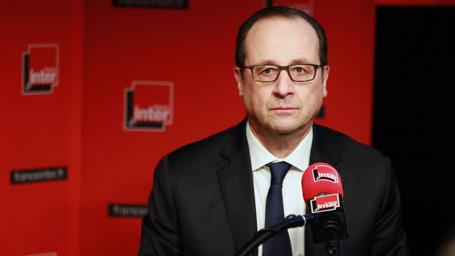 French President Francois Hollande prepares to answer a reporter's question during a live interview on French radio station France Inter in Paris Monday, Jan. 5, 2015. (AP Photo/Remy de la Mauviniere/Pool)