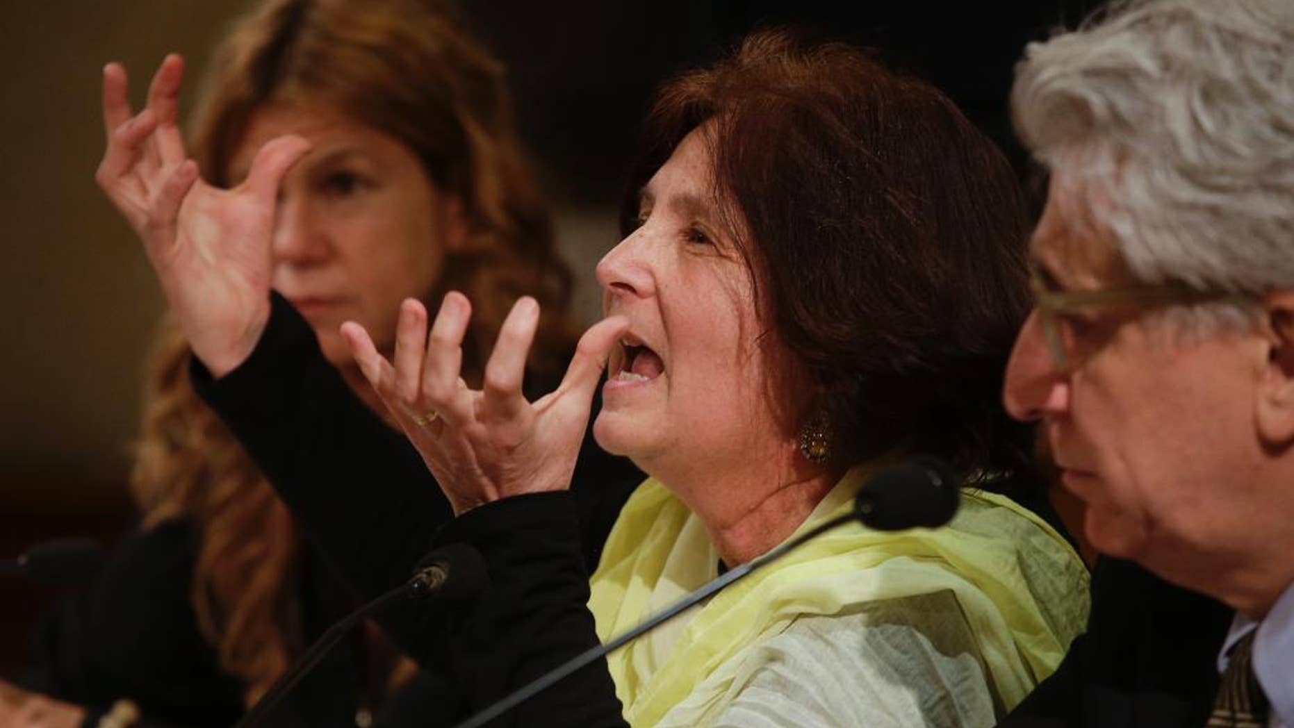 FILE -- In this Tuesday, March 29, 2016 file photo, Paola, the mother of Giulio Regeni, center, flanked by lawyer Alessandra Ballerini, left, and by senator Luigi Manconi attend a press conference at the Italian Senate, in Rome. The editor of Egypt's top state newspaper called on Egyptian authorities Sunday, April 3, 2016, to seriously deal with the case of an Italian student tortured and killed in Cairo, saying officials who didn't realize the gravity of the case are risking Egyptian-Italian relations. Italian Premier Matteo Renzi has insisted Italy will settle for nothing less than the truth. (AP Photo/Gregorio Borgia, File)