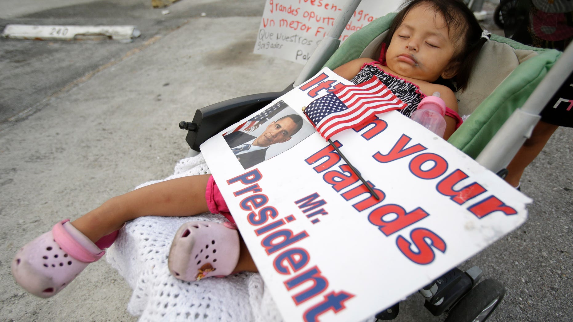 Diana Jimenez, 2, sleeping through a rally in Homestead, Fla., on April 30, 2014.