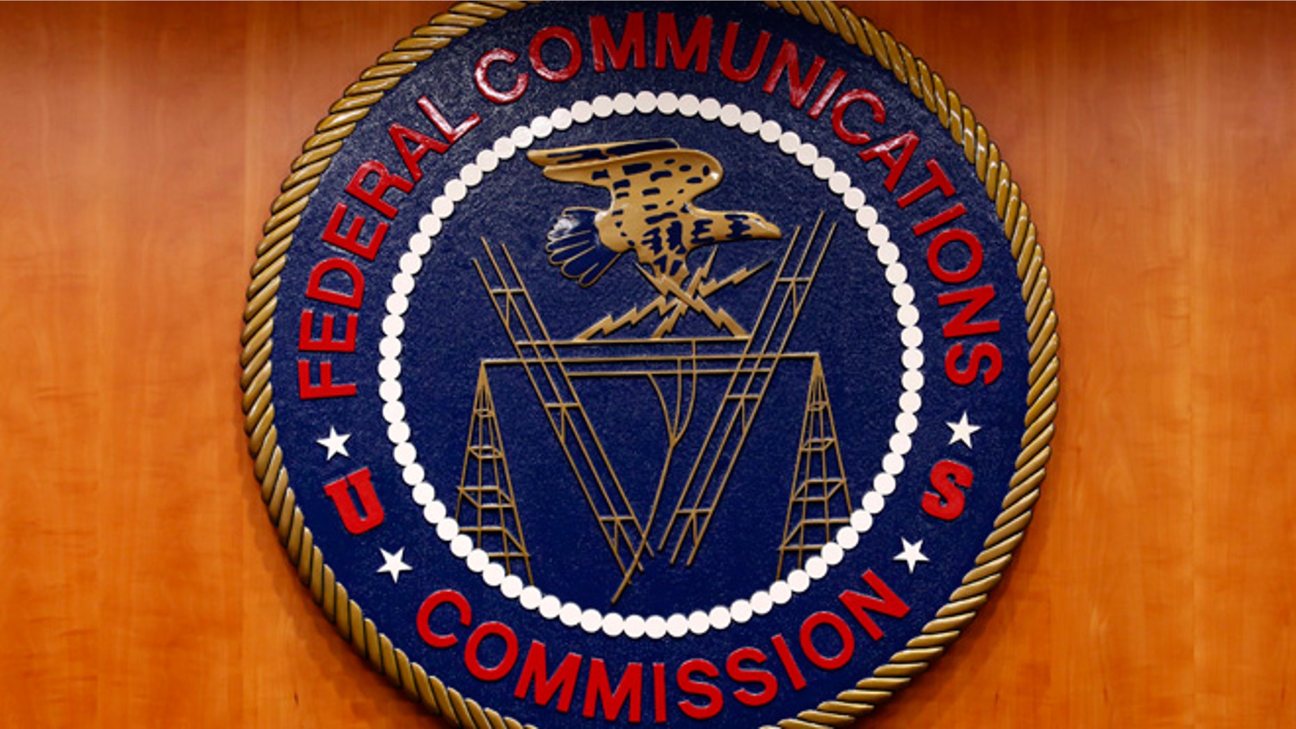 Feb. 26, 2015: The Federal Communications Commission (FCC) logo is seen before a net neutrality hearing in Washington.