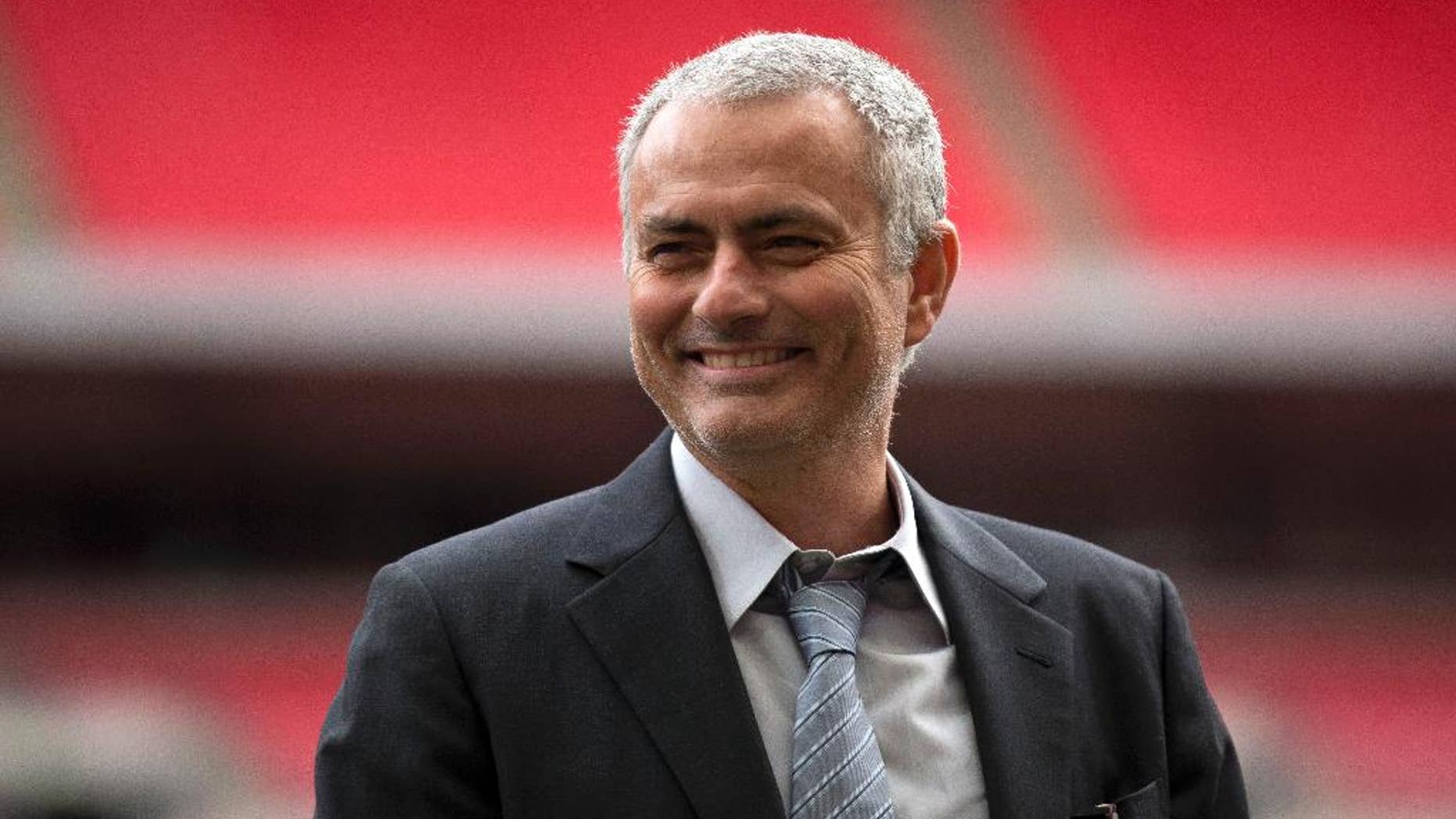 FILE- In this Monday, Feb. 1, 2016 file photo, former Chelsea manager Jose Mourinho smiles as he attends an event at Wembley Stadium in London. Now manager of Manchester United, Mourinho says the club is in need of both a quick-fix and long-term stability, as the 53-year-old enigmatic Portuguese was presented to the media for the first time Tuesday July 5, 2016. (AP Photo/Matt Dunham, FILE)