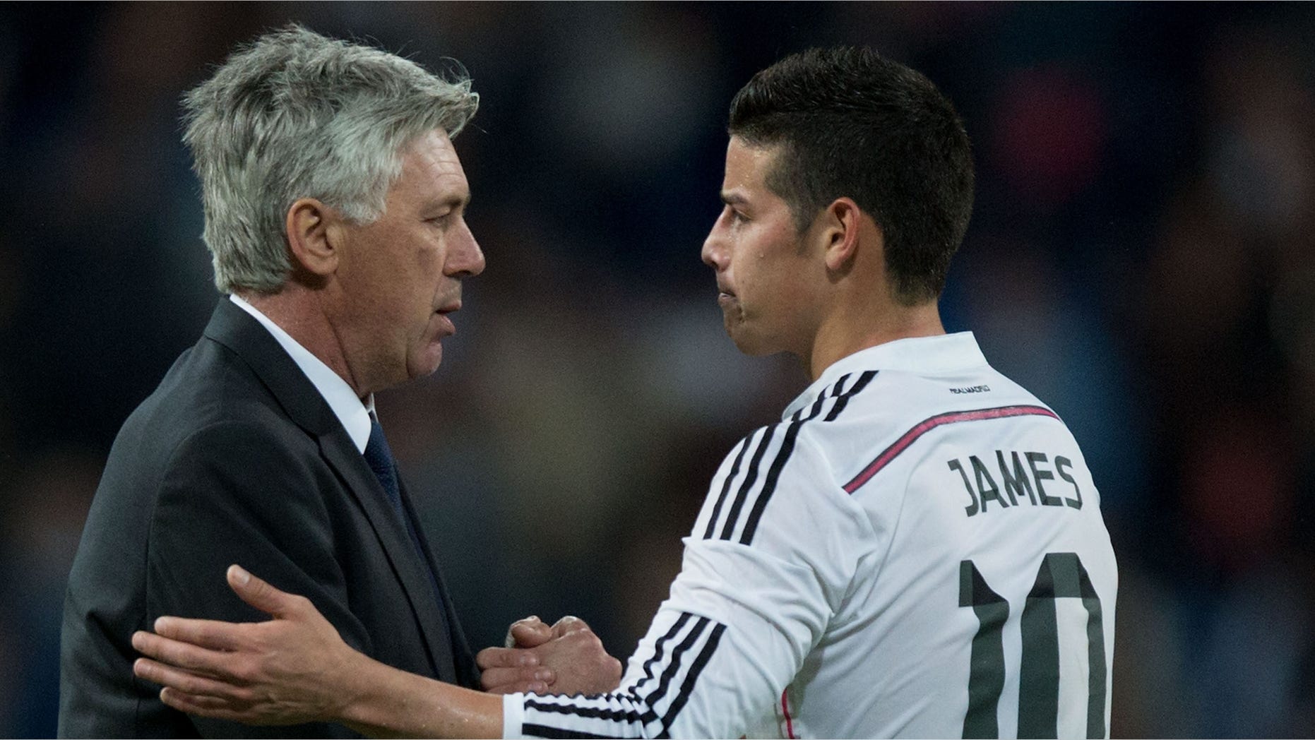 Carlo Ancelotti shakes hands with player James Rodriguez on April 18, 2015 in Madrid, Spain.
