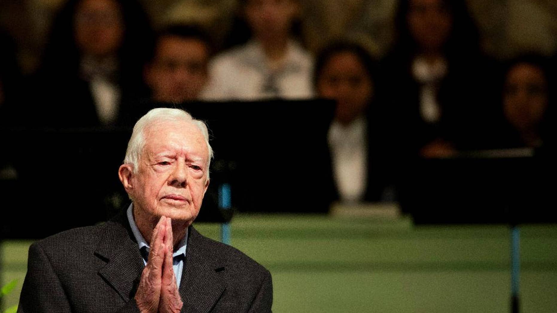 FILE - In a Sunday, Aug. 23, 2015 file photo, former President Jimmy Carter teaches Sunday School class at Maranatha Baptist Church in his hometown, in Plains, Ga. Former President Carter said Sunday, Dec. 6, 2015, that no cancer was detected in his latest scan. (AP Photo/David Goldman, File)