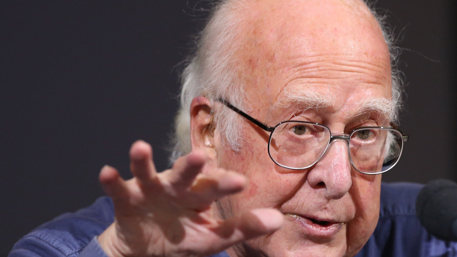 Oct. 11, 2013: Britain's Professor Peter Higgs gestures during a press conference in Edinburgh, Scotland in this file photo.