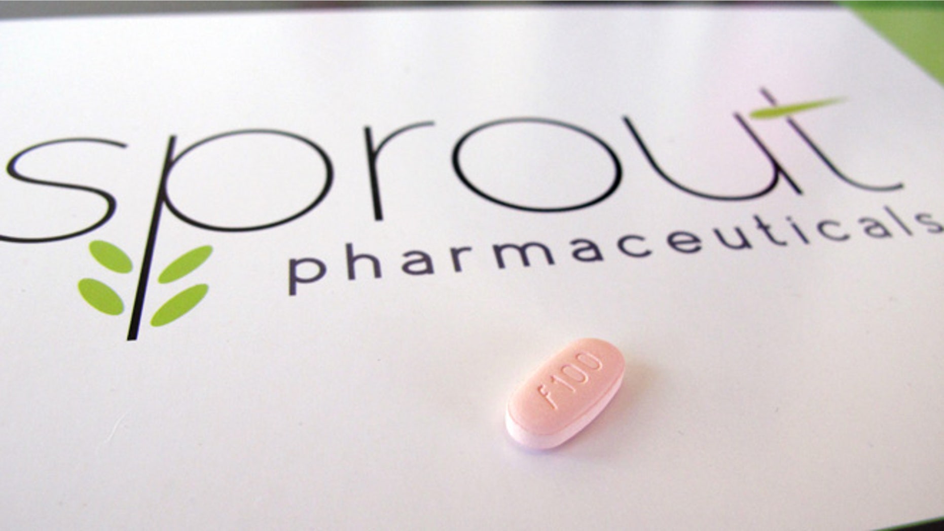 In this June 22, 2015, photo, a tablet of flibanserin sits on a brochure for Sprout Pharmaceuticals in the company's Raleigh, N.C., headquarters. Sprout soon may succeed where many of the world's largest pharmaceutical companies have failed: in winning Food and Drug Administration (FDA) approval for flibanserin, dubbed Addyi, the first drug to boost women's sexual desire.