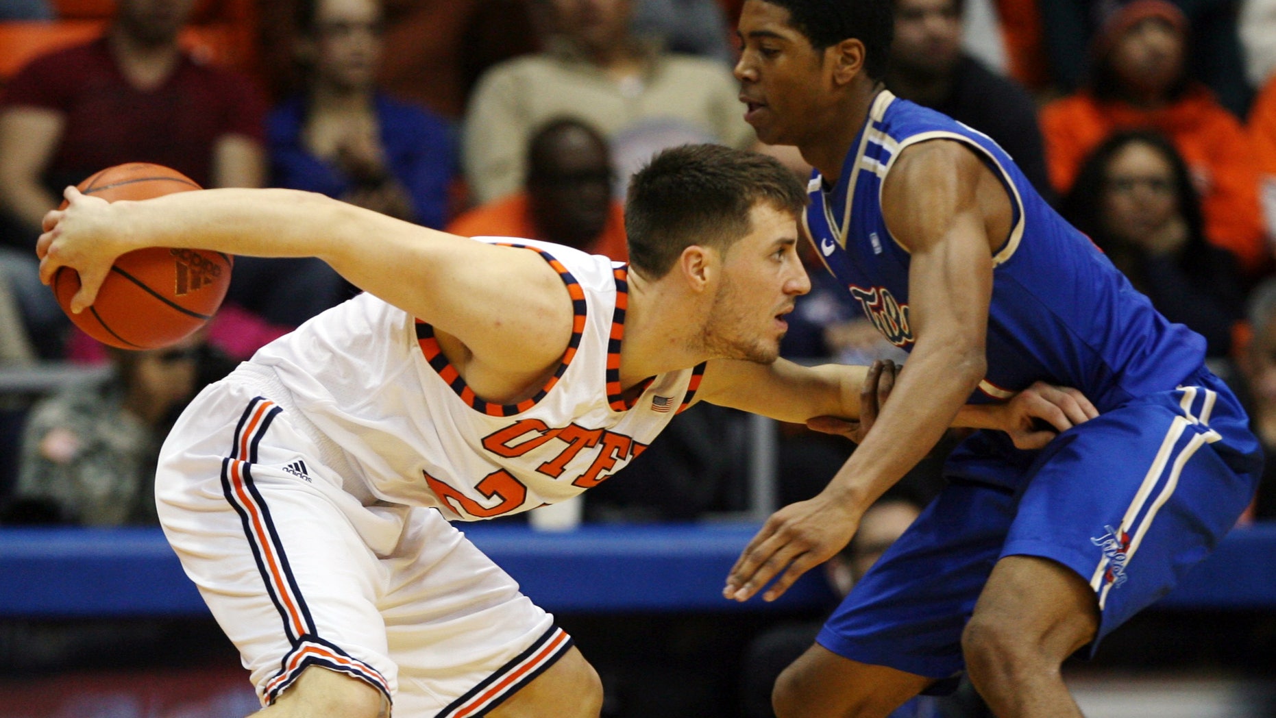 UTEP's Konner Tucker, left, hides the ball from Tulsa's Rashad Smith during the first half of their NCAA college basketball game, Saturday, Feb. 9, 2013, in El Paso, Texas. (AP Photo/The El Paso Times, Victor Calzada) EL DIARIO OUT; JUAREZ MEXICO OUT; IF USE ON LAM OR LAT AND EL DIARIO DE EL PASO OUT