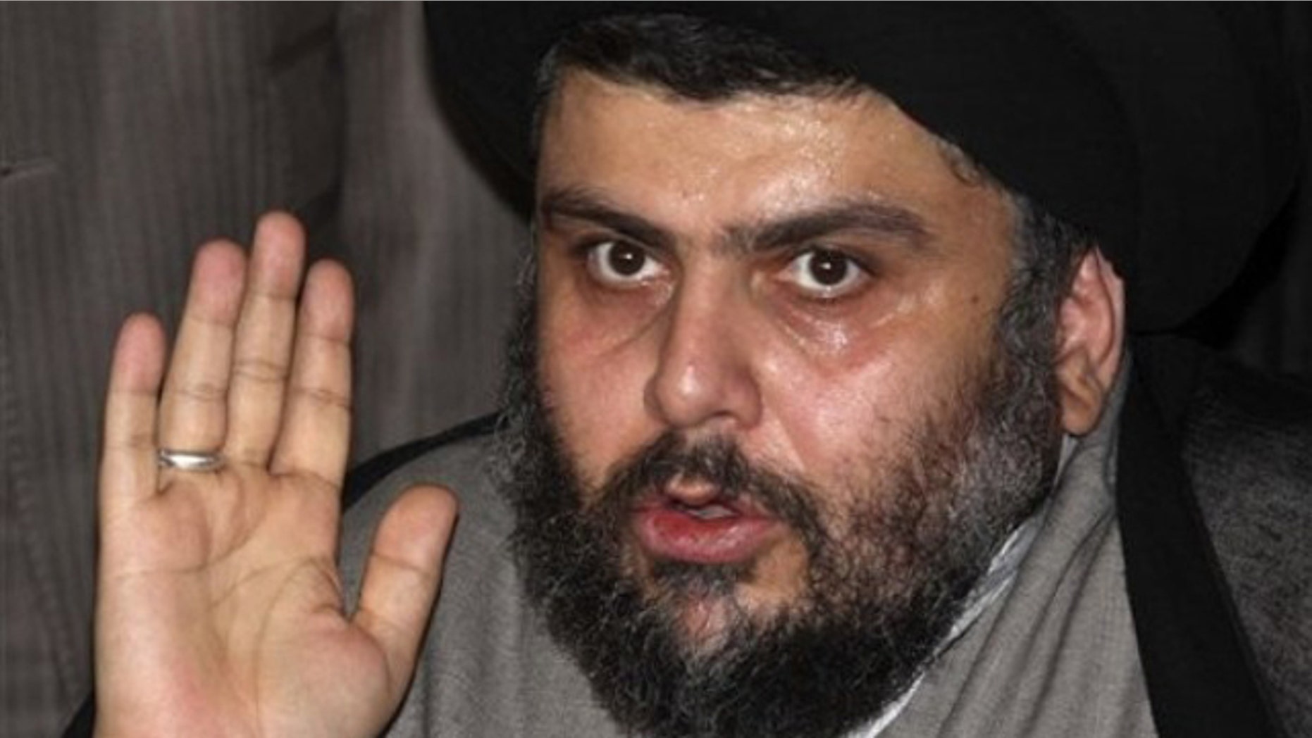 July 19: Muqtada al-Sadr, one of Iraq's most powerful Shiite political clerics, speaks to reporters following a meeting with former Iraqi Prime Minister Ayad Allawi in Damascus, Syria.