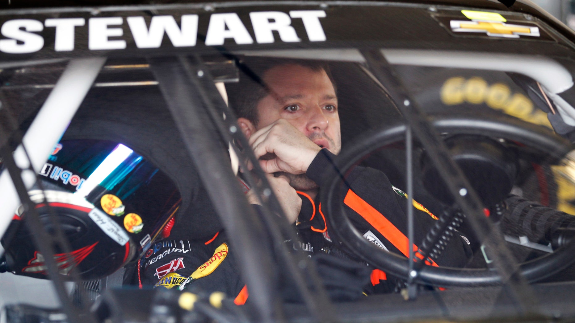 Tony Stewart prepares to go out onto the track during practice for the NASCAR Daytona 500 Sprint Cup Series auto race at Daytona International Speedway, Saturday, Feb. 16, 2013, in Daytona Beach, Fla. (AP Photo/Terry Renna)