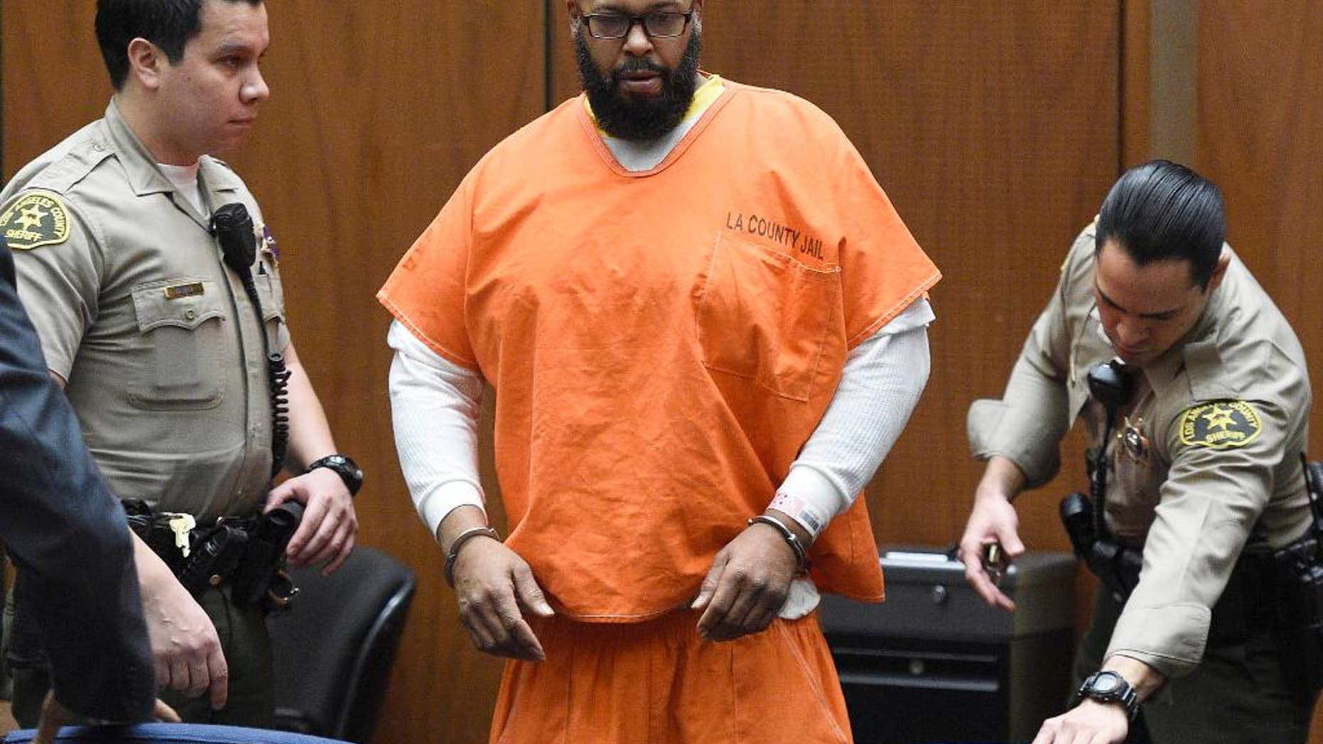 FILE - In this March 9, 2015 file photo, Marion "Suge" Knight arrives in court for a hearing about evidence in his murder case, in Los Angeles. Knight appeared in a Los Angeles courtroom on Wednesday April 8, 2015, in a wheelchair and was given time by a judge to hire a new attorney to represent him in a robbery case filed against him and comedian Katt Williams. (AP Photo/Kevork Djansezian, Pool, File)