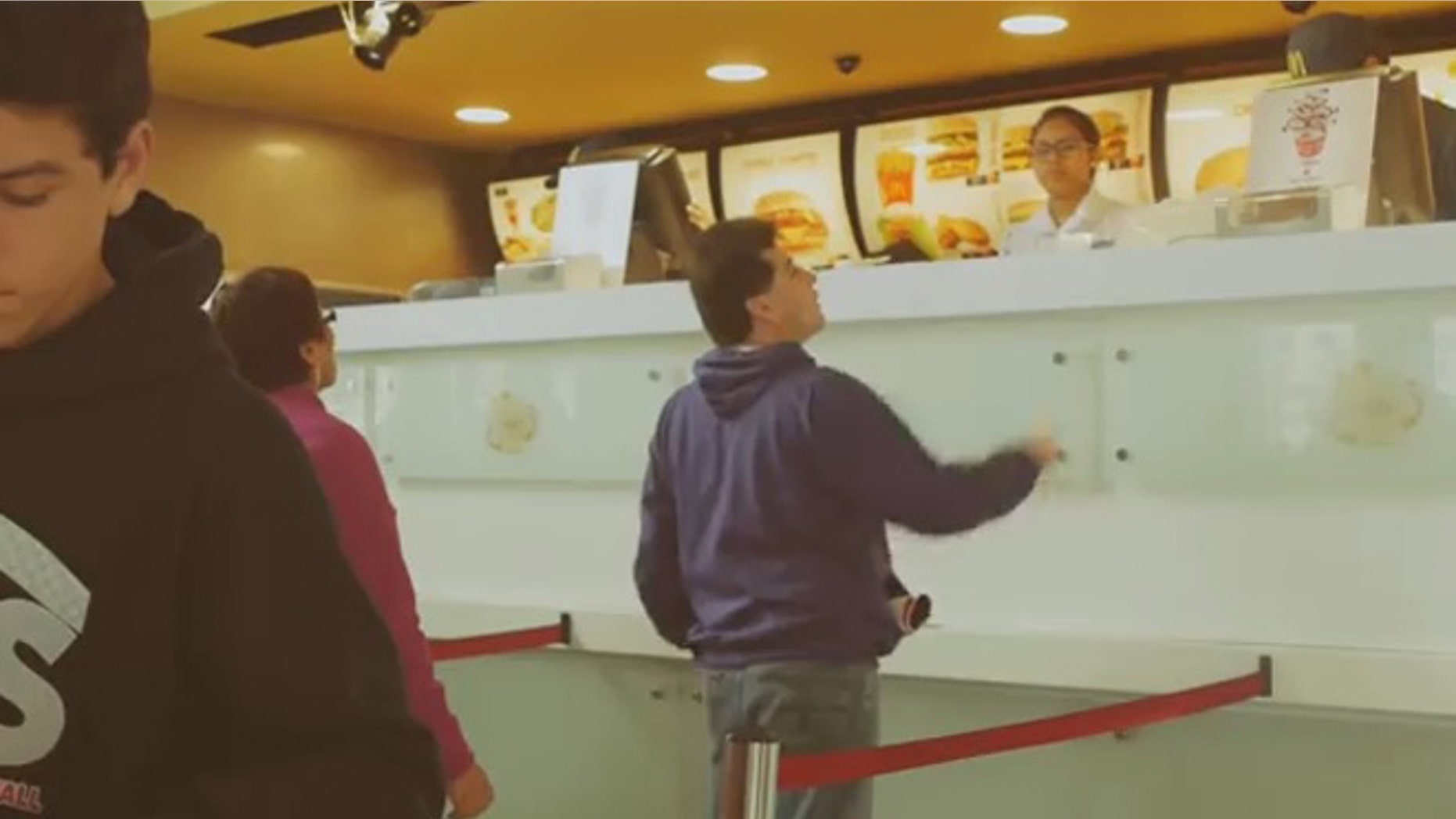 A customer peers above the larger than life counter.
