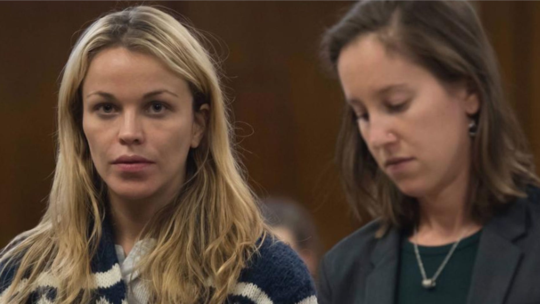 Jacqueline Kent Cooke, on the left, is arraigned in Manhattan Criminal Court.