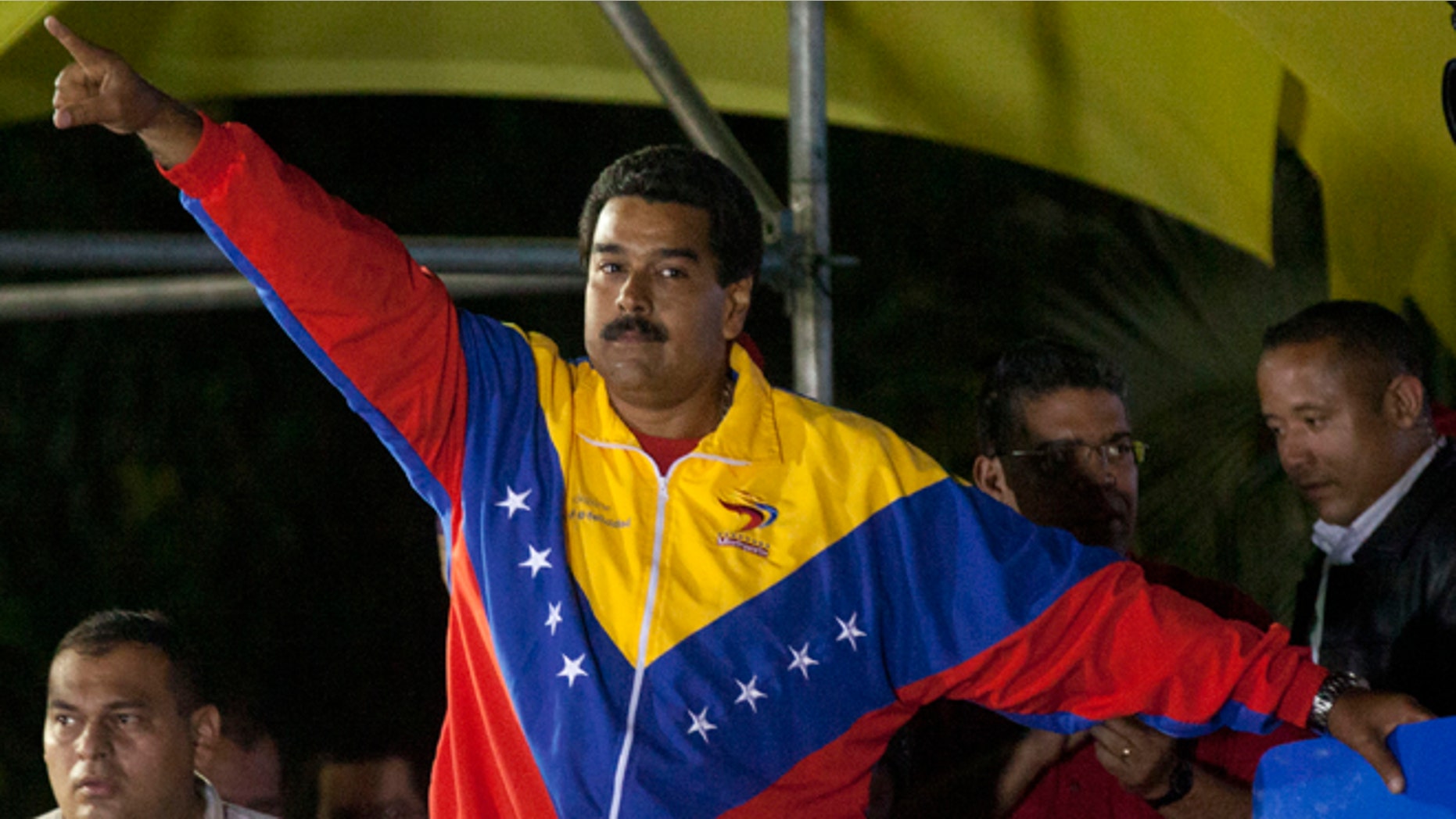Venezuela's newly elected President Nicolas Maduro celebrates his victory after the official results of the presidential elections were announced, at the Miraflores Palace in Caracas, Venezuela, late Sunday, April 14, 2013. Maduro, Hugo Chavez's hand-picked successor, won a razor-thin victory in Sunday's special presidential election, edging the opposition leader Henrique Capriles by only about 300,000 votes, electoral officials announced. (AP Photo/Ramon Espinosa)