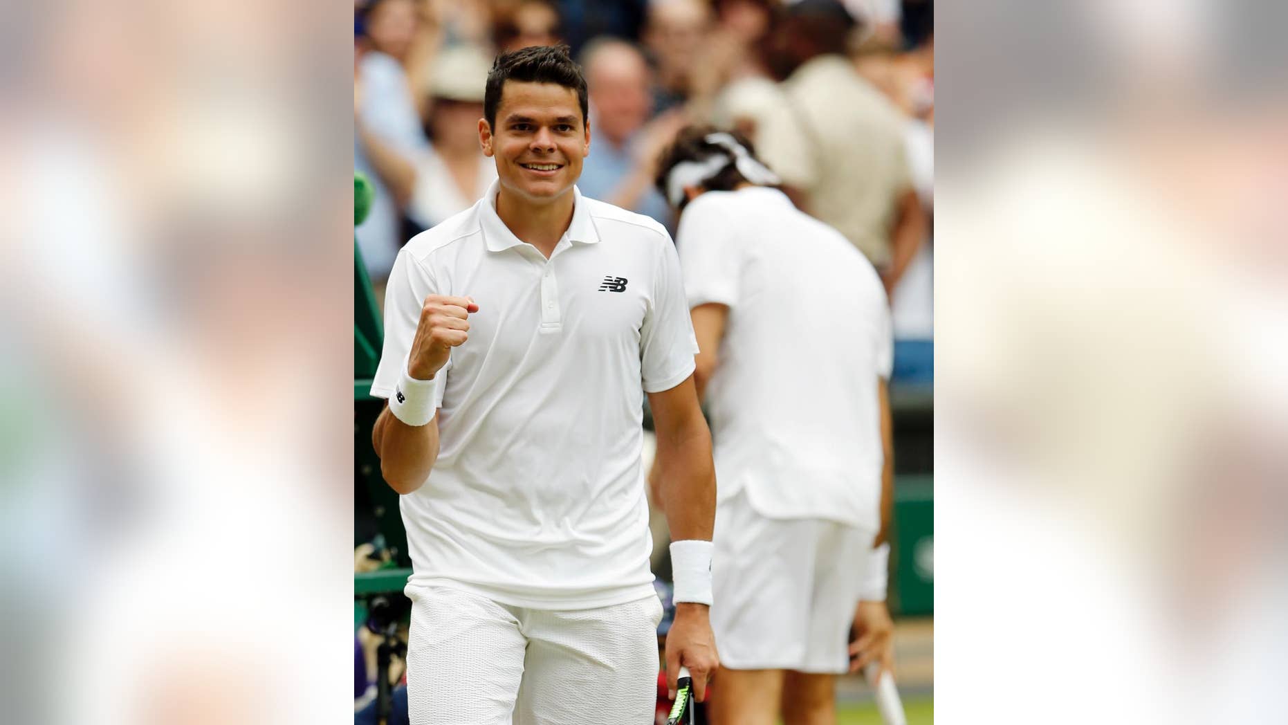 Milos Raonic of Canada celebrates after beating Roger Federer of Switzerland in their men's semifinal singles match on day twelve of the Wimbledon Tennis Championships in London, Friday, July 8, 2016. (AP Photo/Alastair Grant)