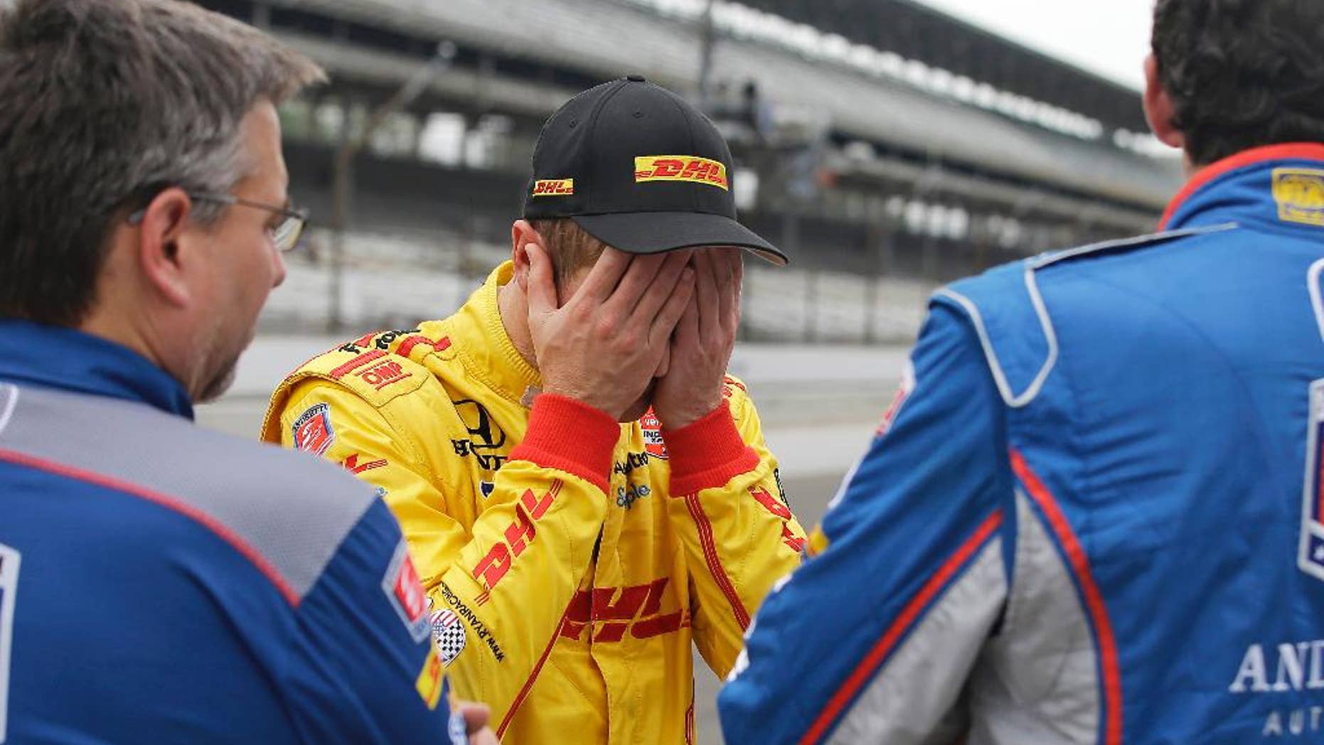Ryan Hunter-Reay reacts after watching the wreck of James Hinchcliffe, of Canada, during practice for the Indianapolis 500 auto race at Indianapolis Motor Speedway in Indianapolis, Monday, May 18, 2015. (AP Photo/Darron Cummings)