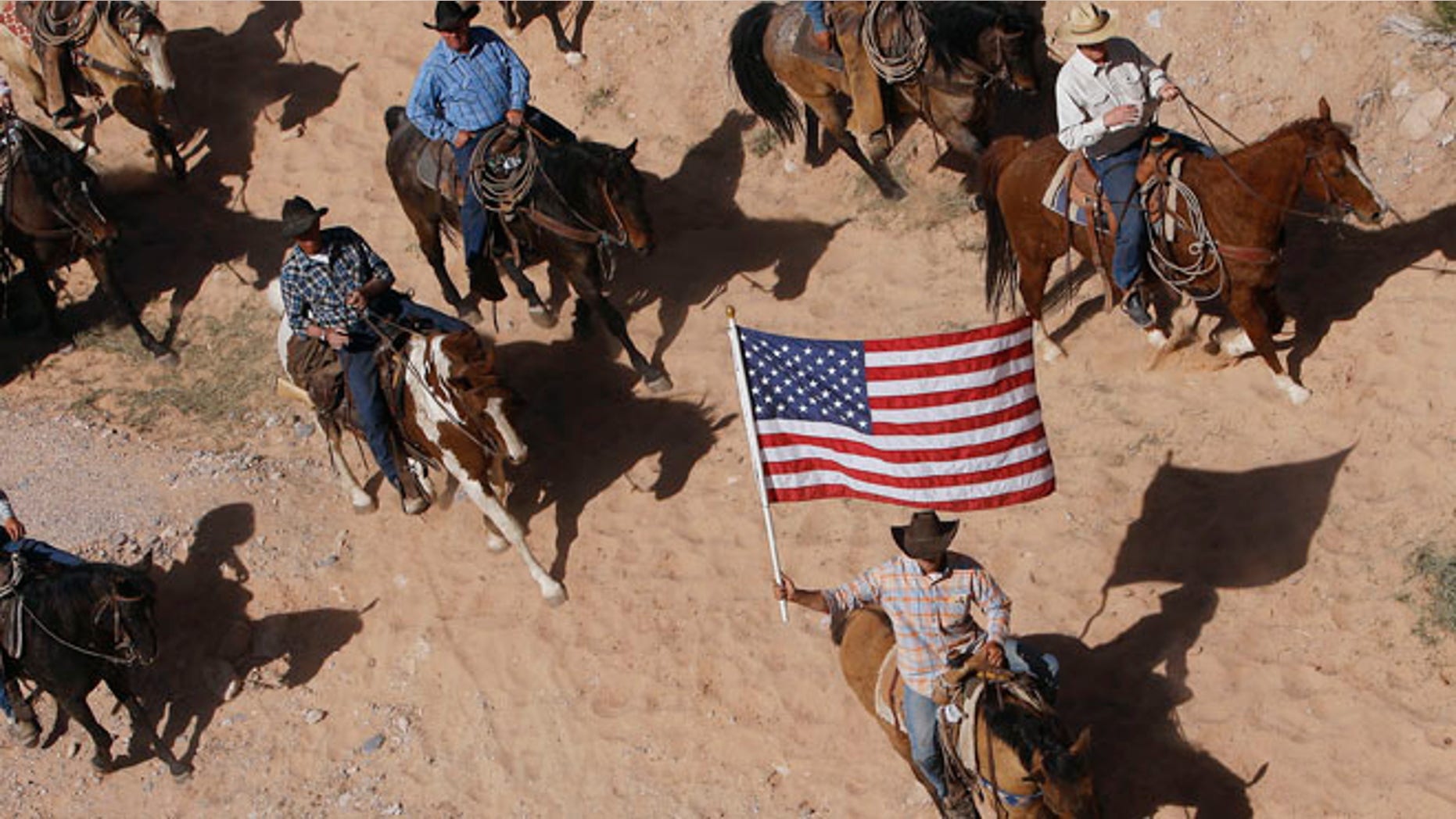 April 12, 2014: The Bundy family and their supporters fly the American flag as their cattle is released by the Bureau of Land Management.