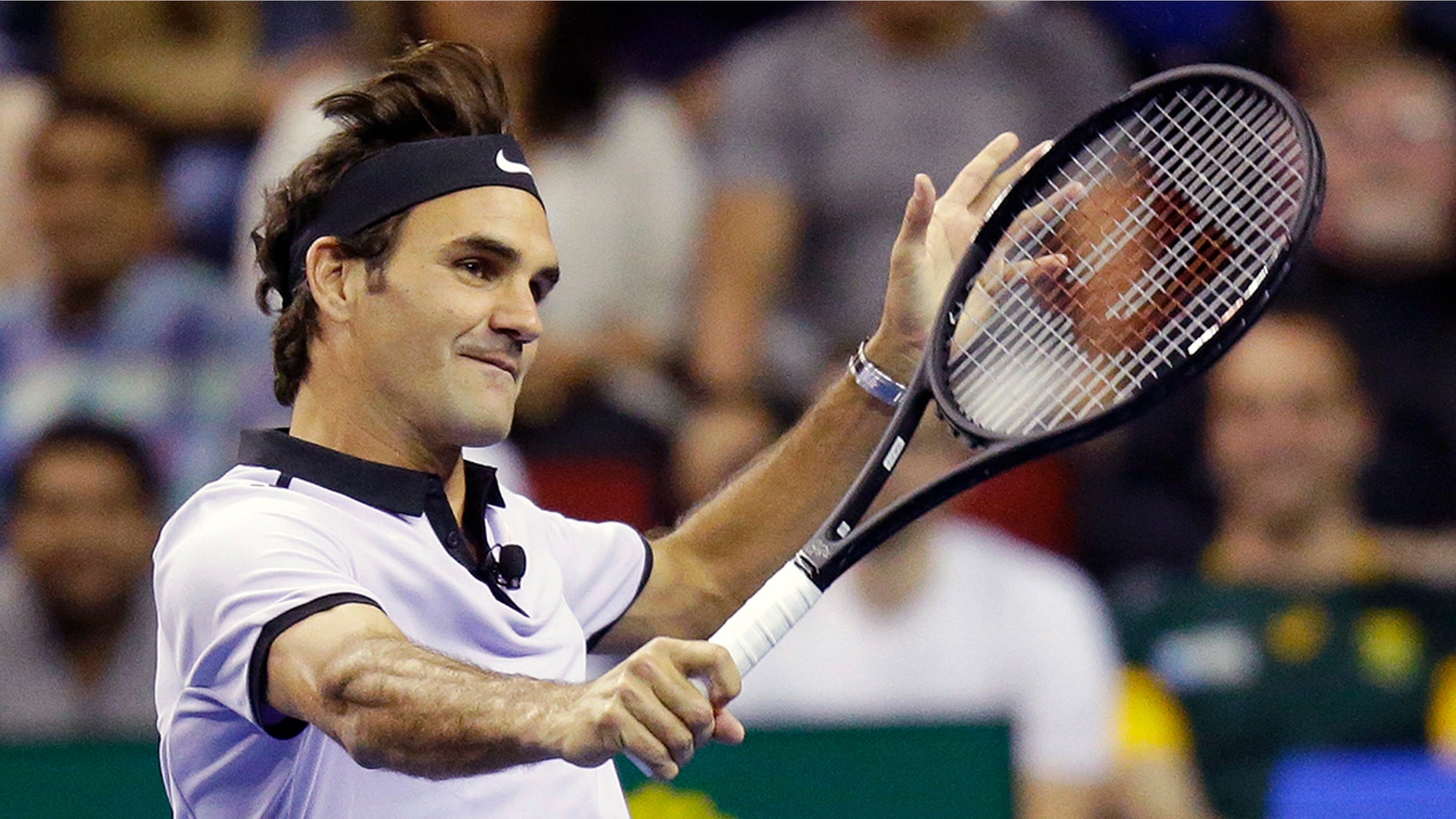 FILE - In this April 29, 2017, file photo, Roger Federer, of Switzerland, returns a volley during an exhibition tennis match in Seattle. Roger Federer says he won't play in the French Open and instead prepare to play on grass and hard courts later this season. Federer posted a message entitled "Roger to skip Roland Garros" on his website on Monday, May 15, 2017. (AP Photo/Ted S. Warren, File)