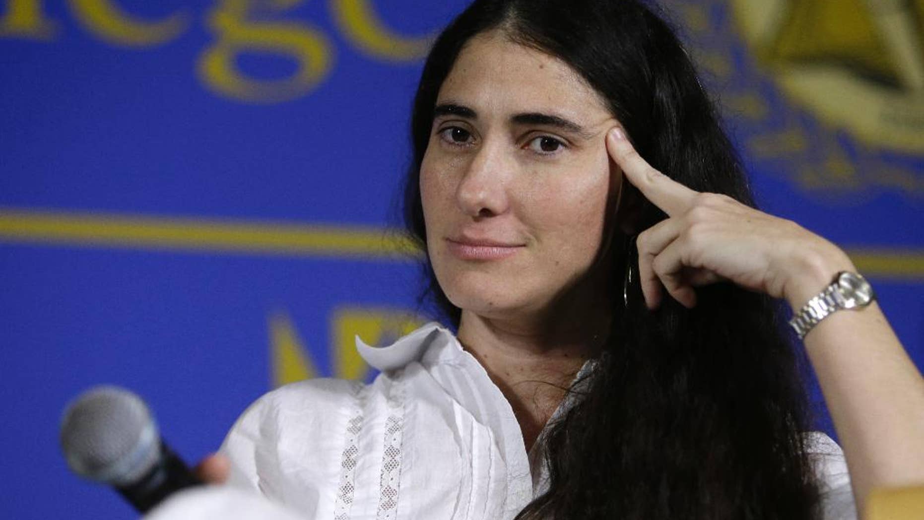 FILE - In this April 1, 2013 file photo, Cuba’s best-known blogger Yoani Sanchez speaks at the Freedom Tower of Miami Dade College, in Miami, Florida. Sanchez said she will start publishing a general-interest newspaper online Wednesday, May 21, 2014, in a move that will test both the government’s openness to free expression and the dissident’s ability to build a following inside her country. (AP Photo/Lynne Sladky, File)