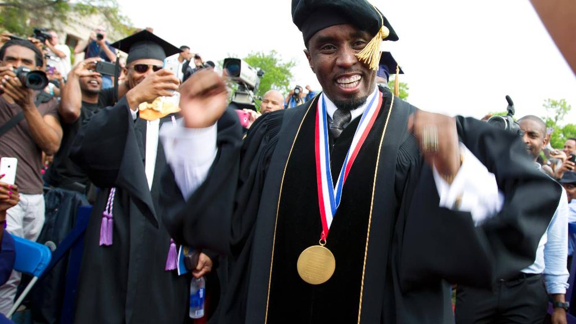 FILE - In this May 10, 2014, file photo, entertainer and entrepreneur Sean "Puff Daddy" Combs arrives to the 2014 Howard University graduation ceremony at Howard University in Washington. Combs announced a $1 million donation to the school on Sept. 23, 2016, during his concert in Washington. (AP Photo/Jose Luis Magana, File)