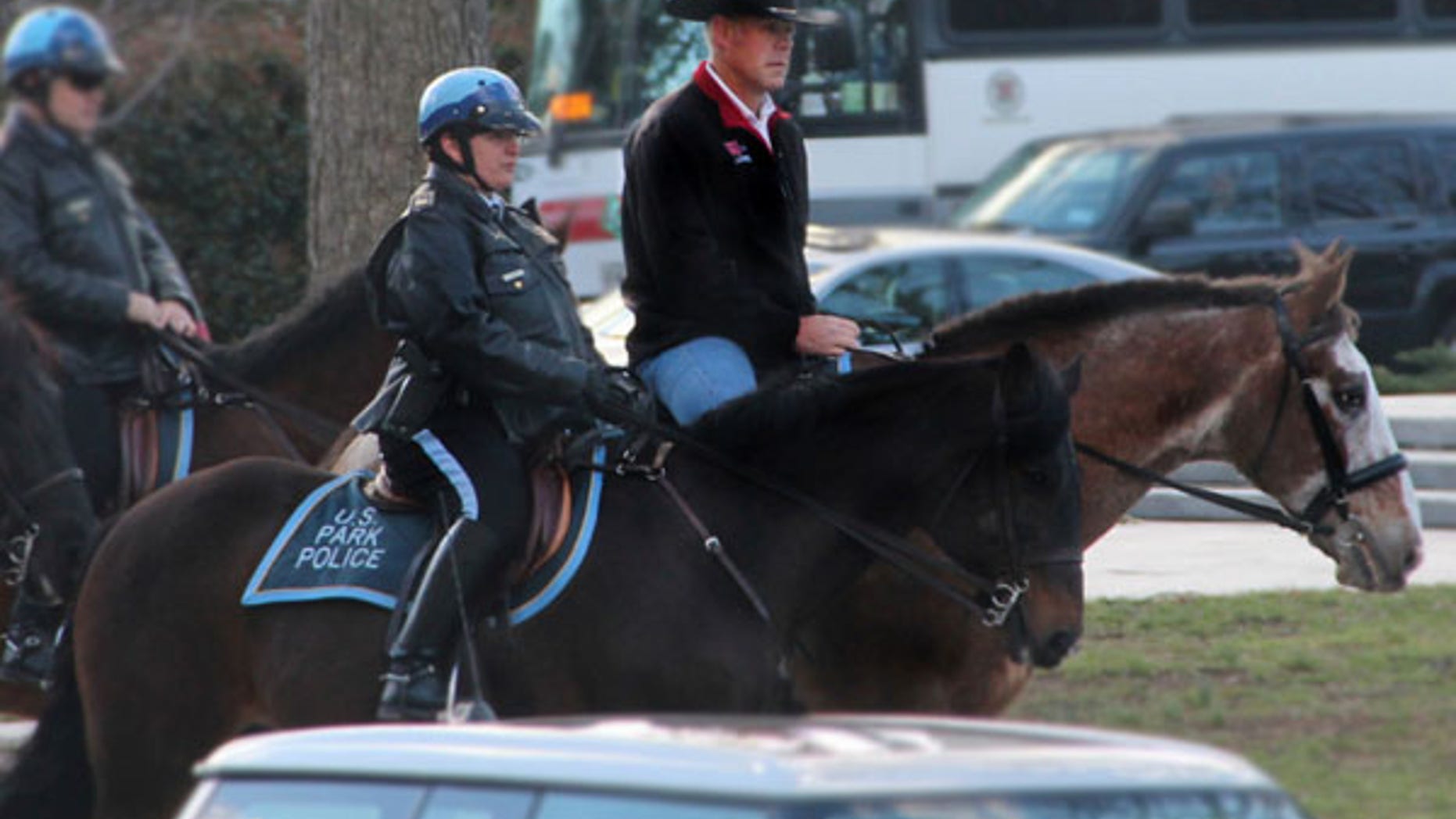 In this photo provided by the Interior Department shows Interior Secretary Ryan Zinke arriving for his first day of work at the Interior Department in Washington