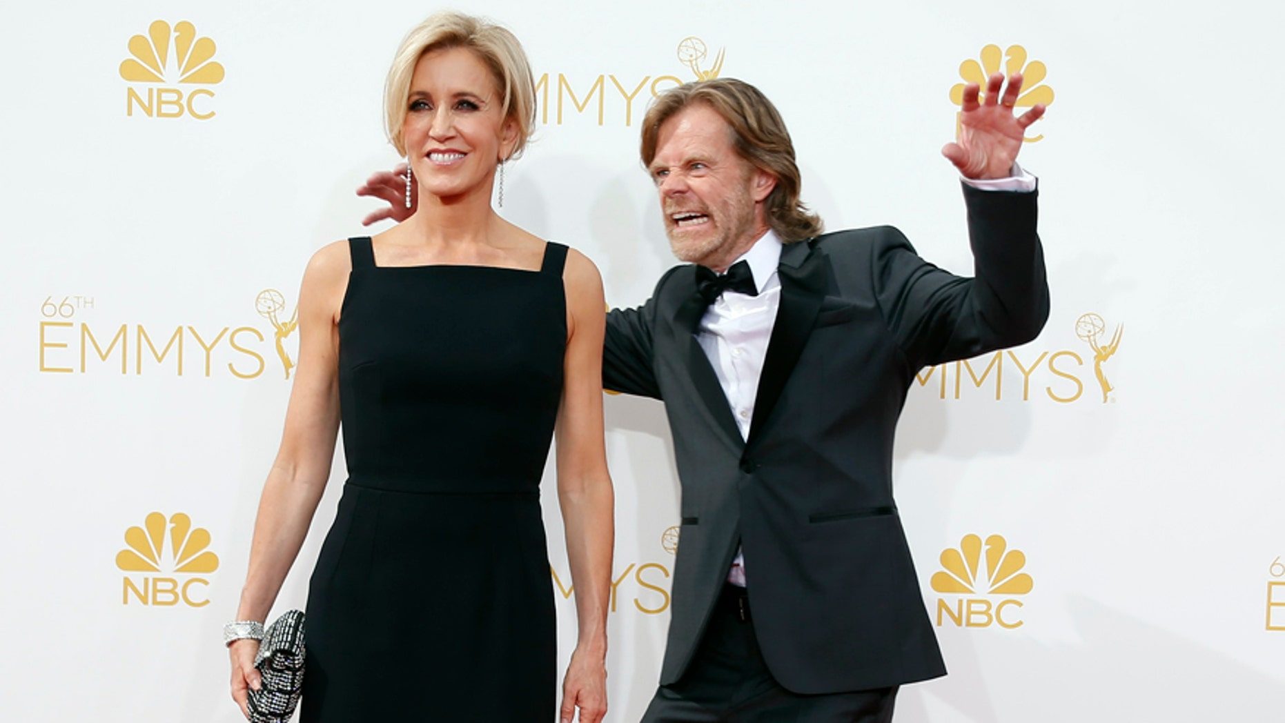 William H. Macy from the Showtime series "Shameless" and his wife, Felicity Huffman, arrive at the 66th Primetime Emmy Awards in Los Angeles, California August 25, 2014. REUTERS/Lucy Nicholson (UNITED STATES -Tags: ENTERTAINMENT)(EMMYS-ARRIVALS) - RTR43Q7X