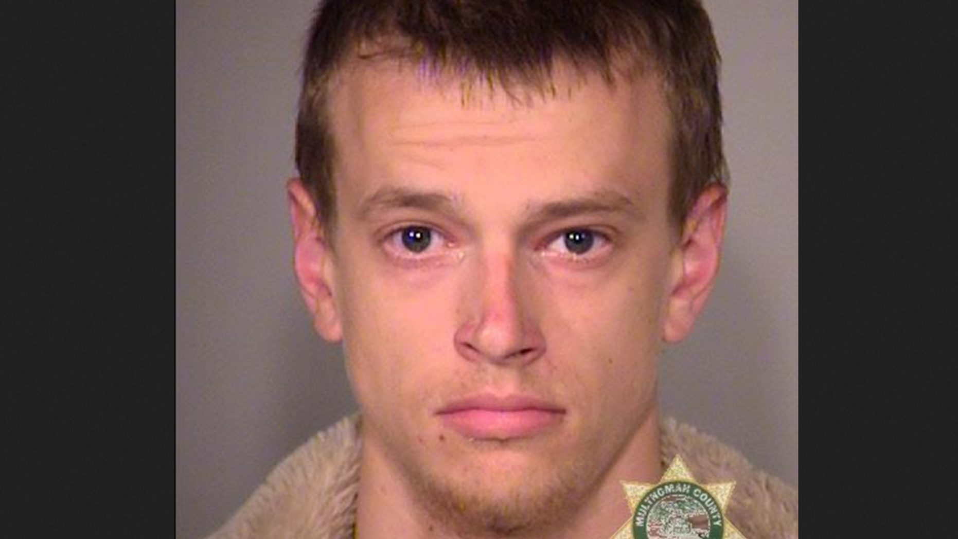 Damion Zachary Feller, 23, admitted to throwing flares into a cop car and a Target department store during violent May Day protests in Portland, Ore. May 1.