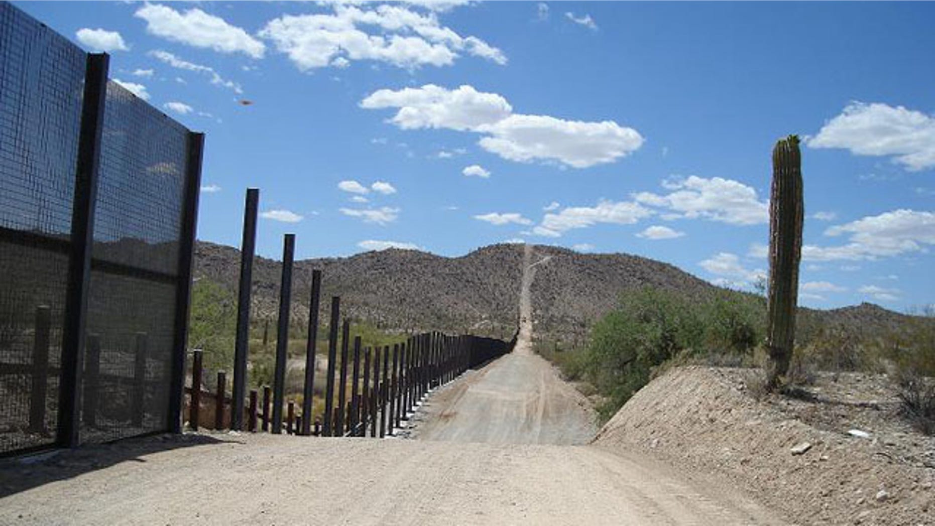 A pedestrian fence and a vehicle barrier are seen at Organ Pipe Cactus National Monument, near Lukeville, Ariz.