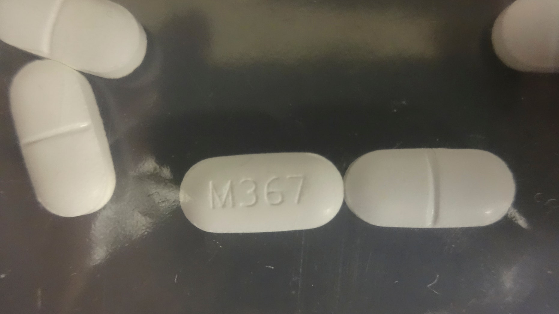 A seized counterfeit hydrocodone tablets in the investigation of a rash of fentanyl overdoses in northern California is shown in this Drug Enforcement Administration (DEA) photo released on April 4, 2016.