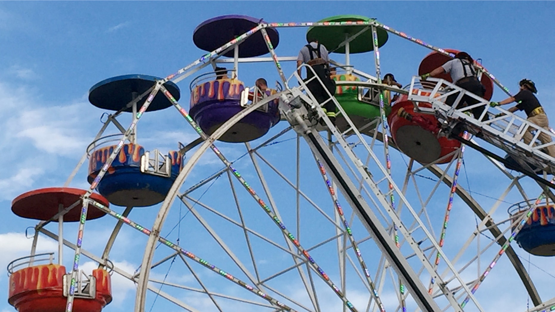 Aug. 8, 2016: Emergency crews unload the ferris wheel at the Greene County Fair in Greeneville, Tenn.