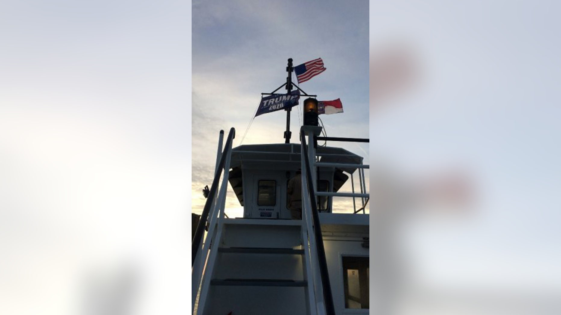 Two North Carolina state workers were suspended for a week without pay after flying a large “Trump 2020” flag atop an Outer Banks ferry in July.