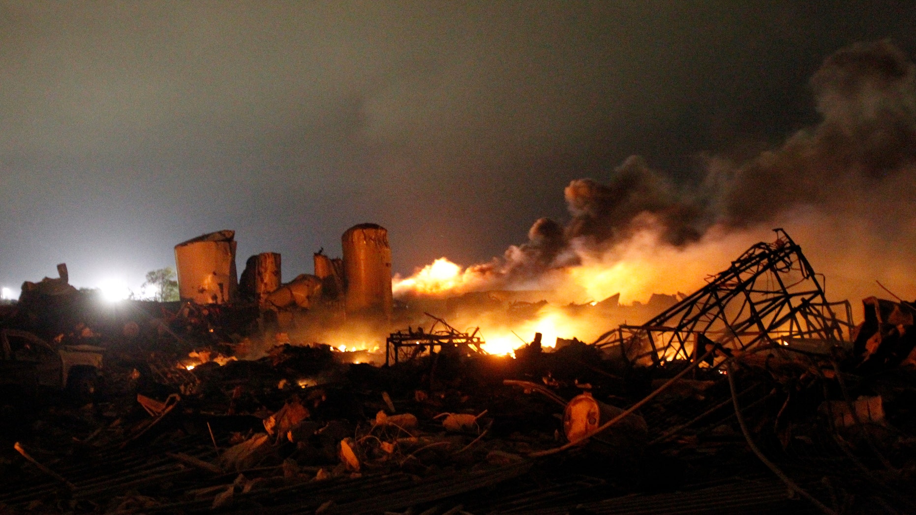 The remains of a fertilizer plant burn after an explosion at the plant in the town of West, near Waco, Texas early April 18, 2013. The deadly explosion ripped through the fertilizer plant late on Wednesday, injuring more than 100 people, leveling dozens of homes and damaging other buildings including a school and nursing home, authorities said.