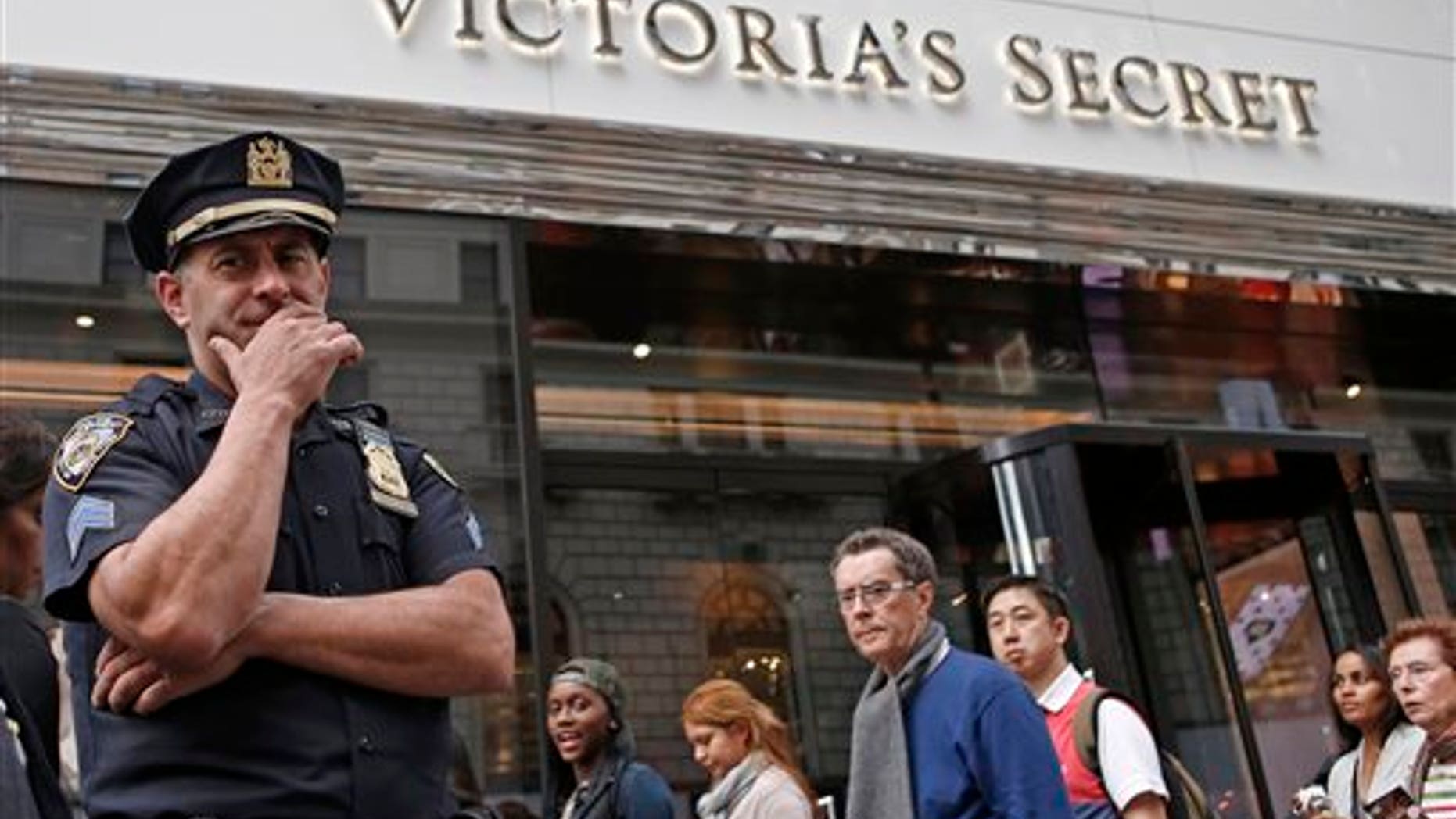 A New York City police officer stands in front of the Victoria's Secret Herald Square store in midtown Manhattan, Thursday, Oct. 17, 2013, in New York. A security guard on the lookout for shoplifters searched two teenage girls as they left the lingerie shop Thursday afternoon, and discovered one of them was carrying what appeared to be a fetus in her bag, police said. (AP Photo/Kathy Willens)