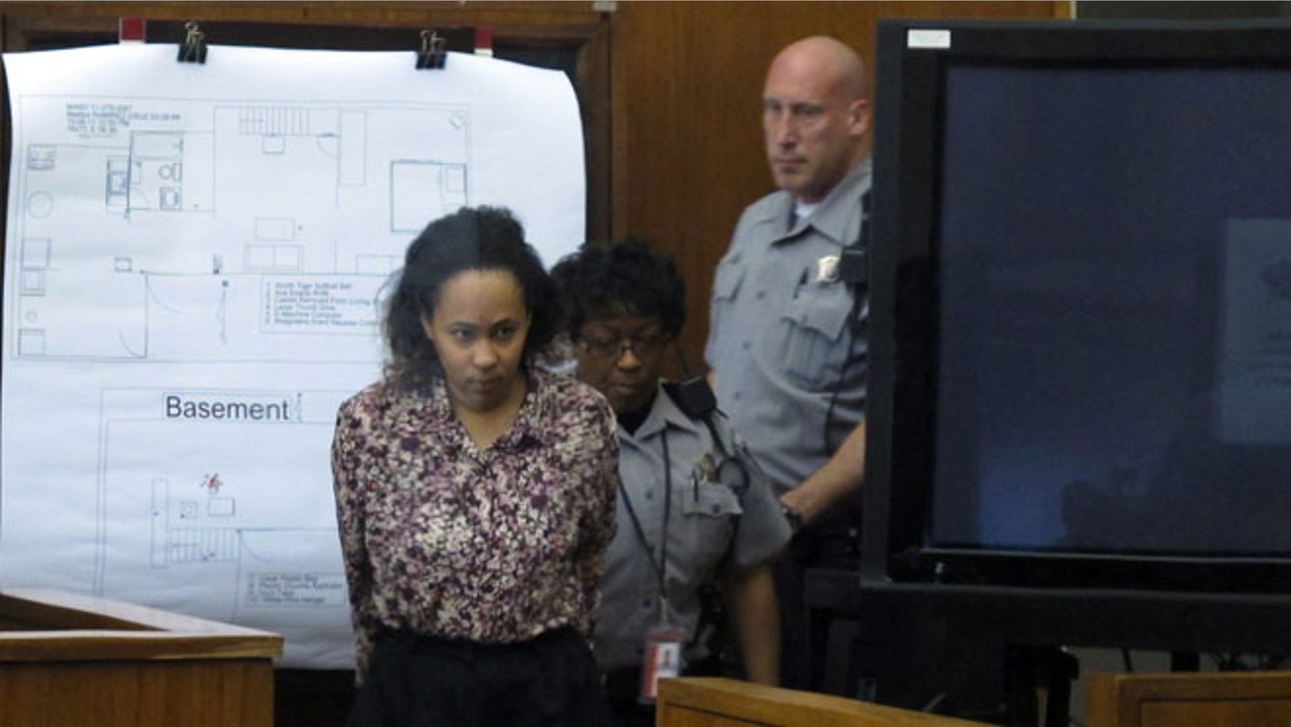 Sept. 19, 2012: Bailiffs lead Annette Morales-Rodriguez into Milwaukee County court for the second day of her trial on charges that she killed a pregnant woman last year and tried to steal her full-term fetus.
