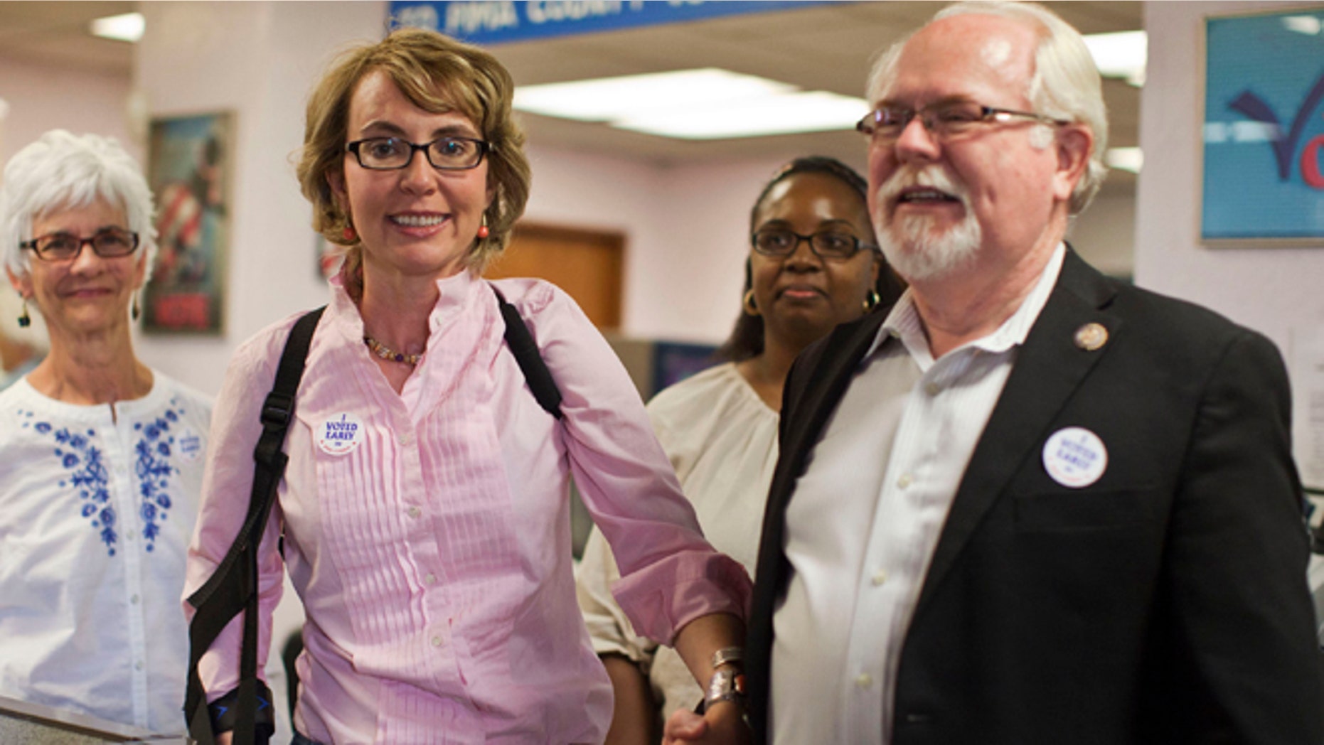 Nov. 5, 2012: Former congresswoman Gabrielle Giffords and Congressman Ron Barber leave the Pima County Recorder's office.