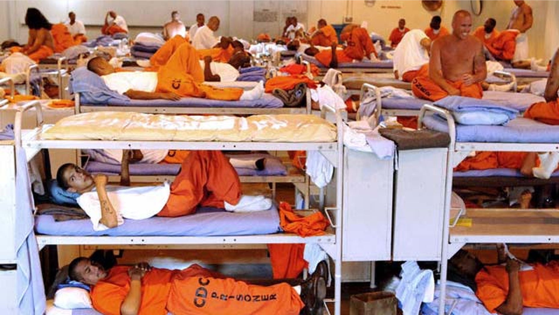 In this undated photo released by the California Department of Corrections, inmates sit in crowded conditions at California State Prison, Los Angeles. California's prison secretary on Friday, Feb. 2, 2007, said the state will force the transfer of up to 5,000 inmates to other states, an indication that an order signed last fall by Gov. Arnold Schwarzenegger has fallen short of expectations. Corrections Secretary James Tilton said the action is needed to relieve overcrowding that threatens the safety of guards and inmates in the nation's largest state prison system. (AP Photo/California Department of Corrections)