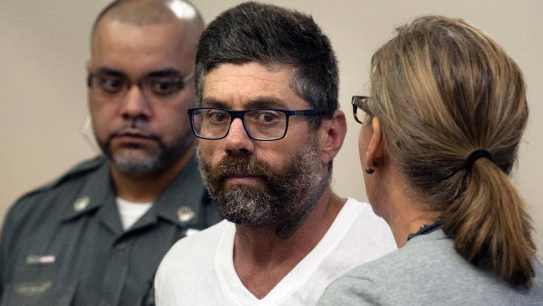 Walter DaSilva, center, of Danbury, Conn., appears in Superior Court for an extradition hearing in Bridgeport, Conn., on Monday, Aug. 8, 2016. DaSilva was arrested in Bridgeport on Friday, and is wanted as a suspect in the July 3 fatal shooting of his 19-year old daughter, Sabrina DaSilva, in New Bedford, Mass. (Ned Gerard/Hearst Connecticut Media via AP, Pool)