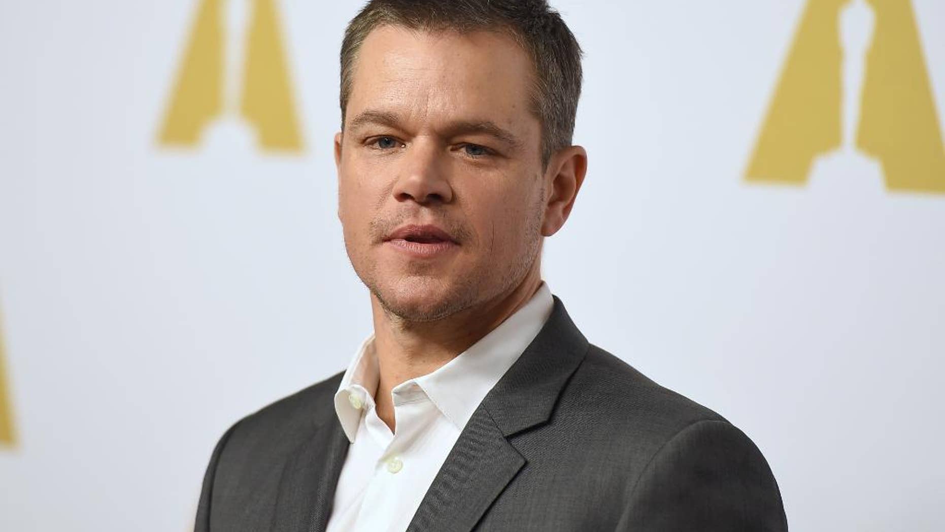 FILE- In this Feb. 8, 2016, file photo, Matt Damon arrives at the 88th Academy Awards Nominees Luncheon at The Beverly Hilton hotel in Beverly Hills, Calif. Matt Damon is returning to the campus of the Massachusetts Institute of Technology, where he played a mathematically gifted custodian in the 1997 hit movie "Good Will Hunting," to deliver the commencement address on Friday, June 3. (Photo by Jordan Strauss/Invision/AP, File)