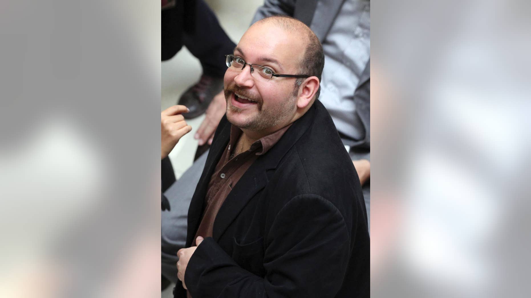 April 11, 2013: In this file photo, Jason Rezaian, an Iranian-American correspondent for the Washington Post, smiles as he attends a presidential campaign of President Hassan Rouhani in Tehran, Iran.