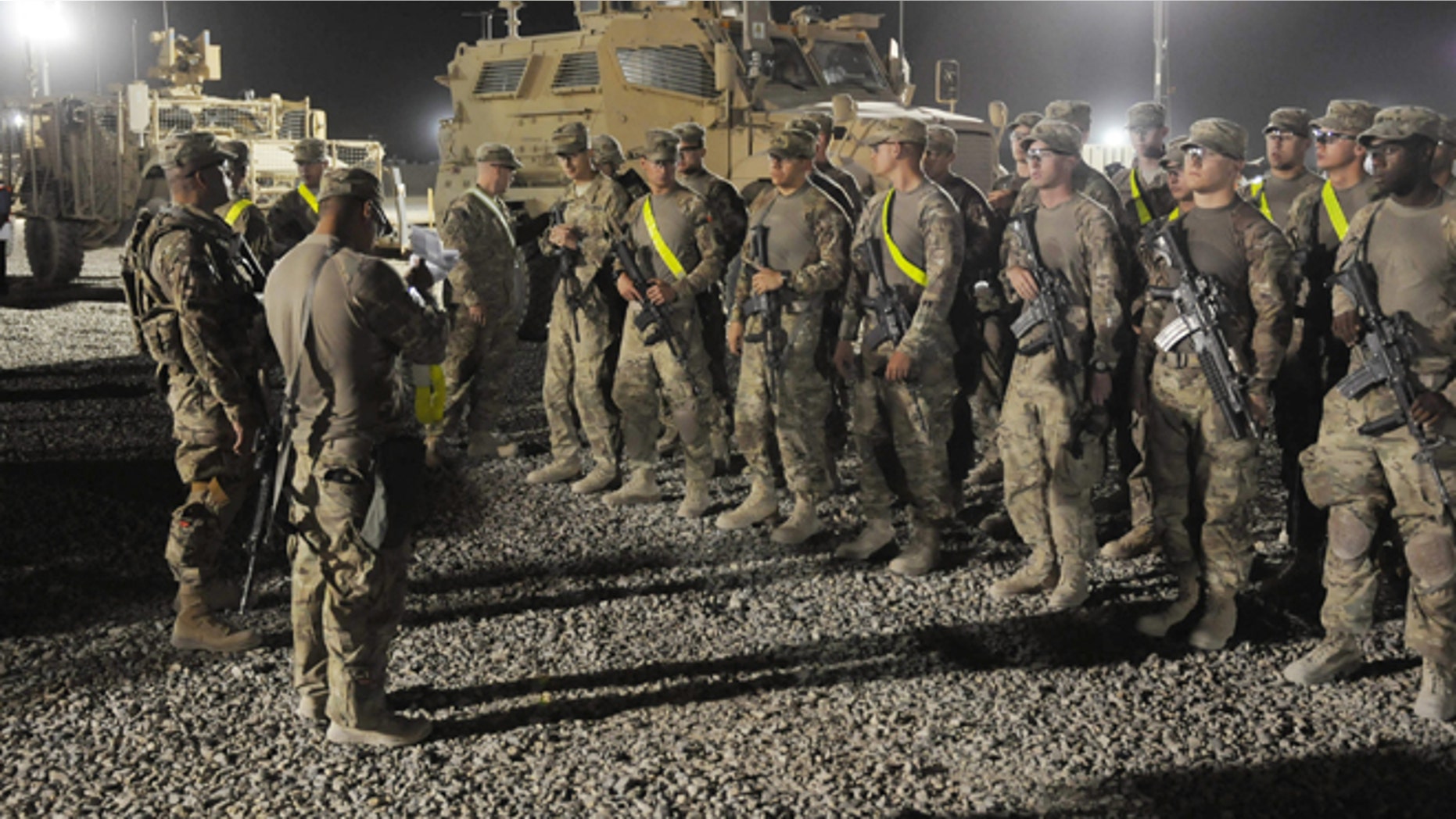 In this Aug. 27, 2012 photo provided by the U.S. Army, U.S. soldiers from the 4th Brigade, 82nd Airborne arrive to turn in their vehicles and equipment as part of the drawdown at the Kandahar Air Field south of Kabul, Afghanistan.