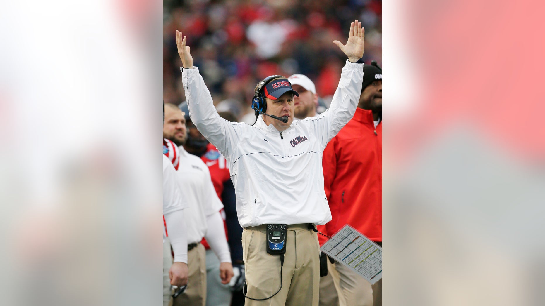 FILE - In this Jan. 5, 2013, file photo, Mississippi head coach Hugh Freeze signals touchdown following a score against Pittsburgh during the second half of the BBVA Compass Bowl NCAA college football game at Legion Field in Birmingham, Ala. The second-year Mississippi coach is poised to haul in a mammoth recruiting class on Wednesday's National Signing Day. (AP Photo/Dave Martin, File)