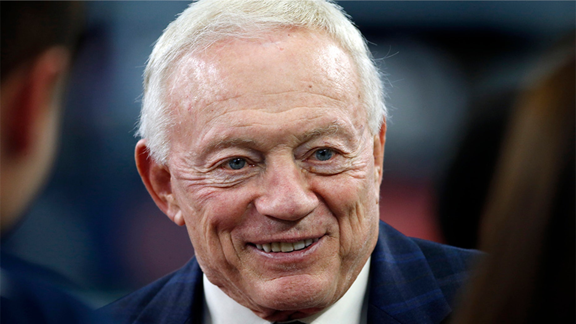 Dallas Cowboys owner Jerry Jones talks on the sideline before a game in 2016.