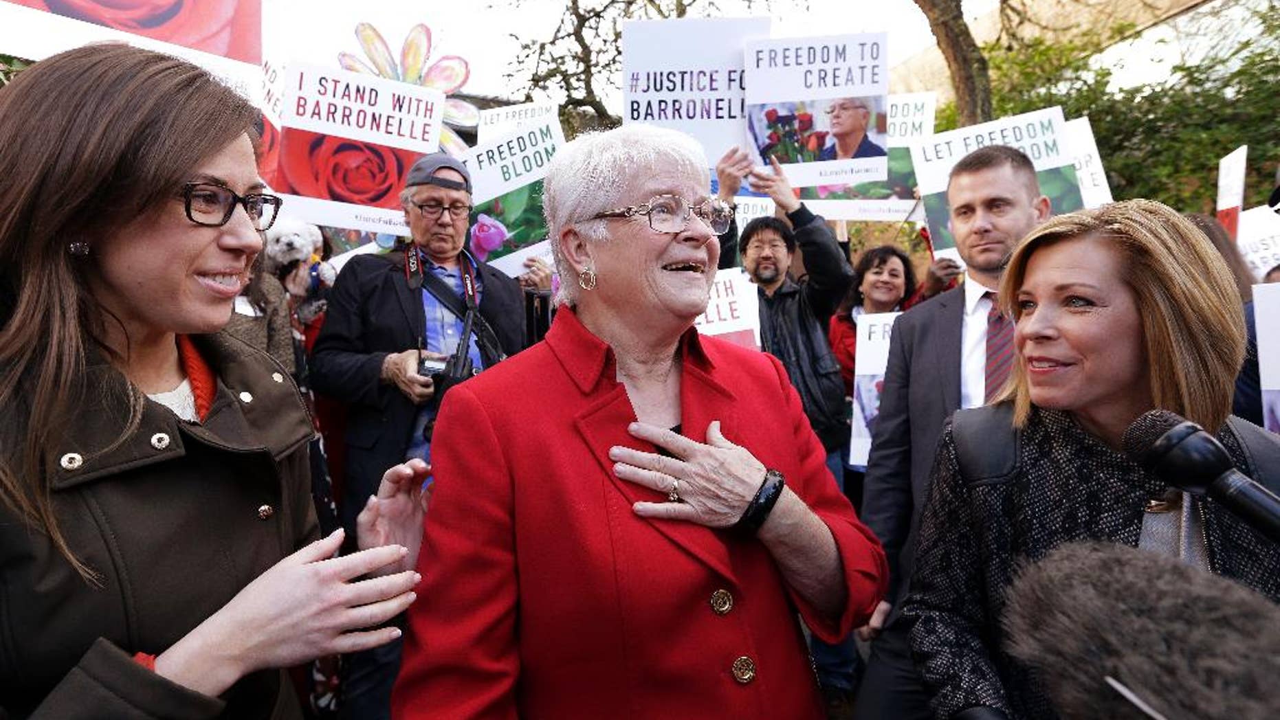 Barronelle Stutzman, center, on Tuesday.