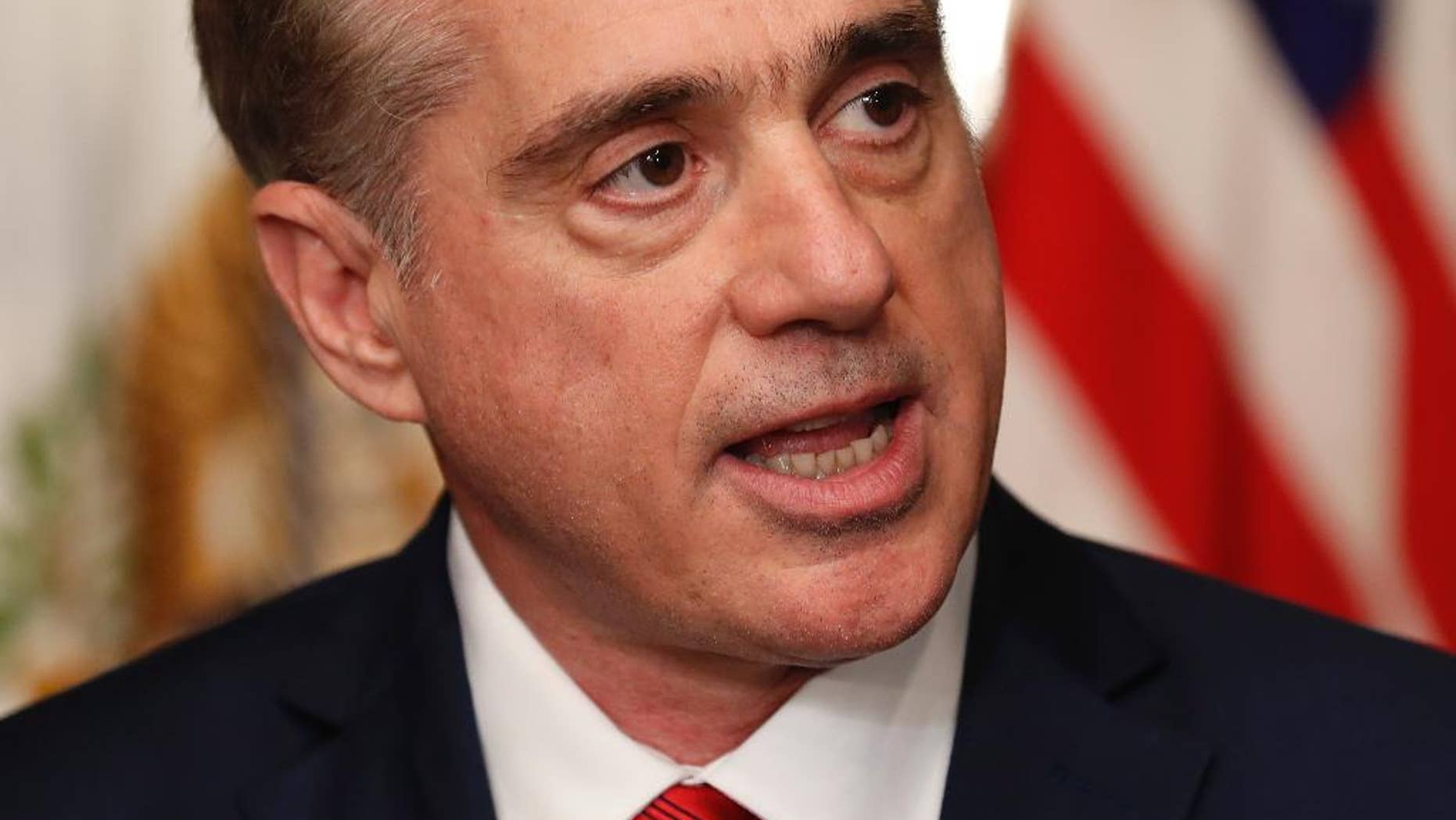 FILE - In this Feb. 14, 2017 file photo, Veterans Affairs Secretary David Shulkin speaks in the Eisenhower Executive Office Building on the White House complex in Washington. Despite the lifting of a federal hiring freeze, the Department of Veterans Affairs is opting to leave thousands of positions unfilled. It is citing the need for a leaner VA as it develops a longer-term plan to allow more veterans to seek medical care in the private sector. (AP Photo/Carolyn Kaster, File)